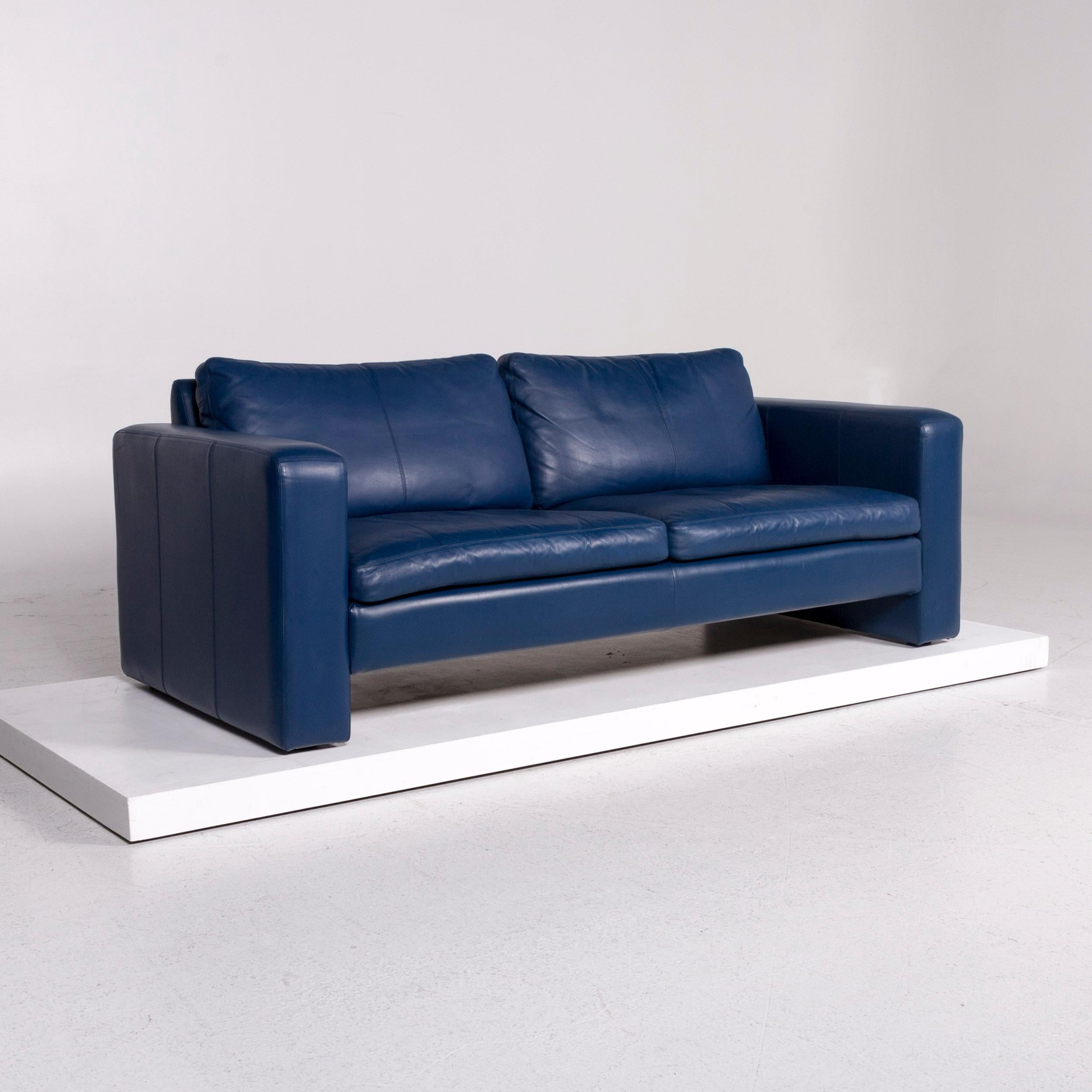 We bring to you a COR Conseta leather sofa blue two-seat couch.
 

 Product measurements in centimeters:
 

Depth 87
Width 192
Height 73
Seat-height 41
Rest-height 59
Seat-depth 52
Seat-width 158
Back-height 32.
 