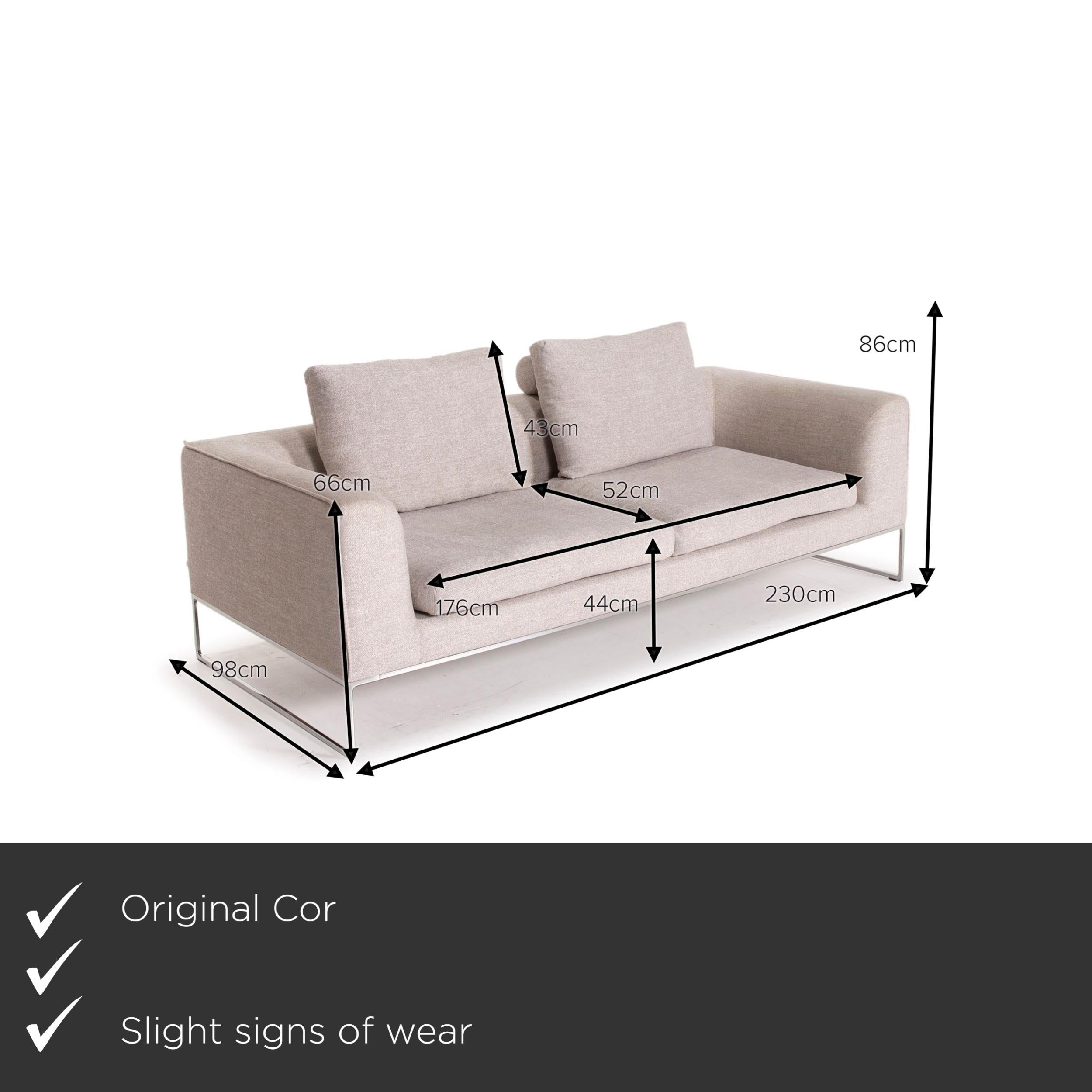 We present to you a COR Mell fabric sofa gray two-seater.


 Product measurements in centimeters:
 

Depth: 98
Width: 230
Height: 86
Seat height: 44
Rest height: 66
Seat depth: 52
Seat width: 176
Back height: 43.
 