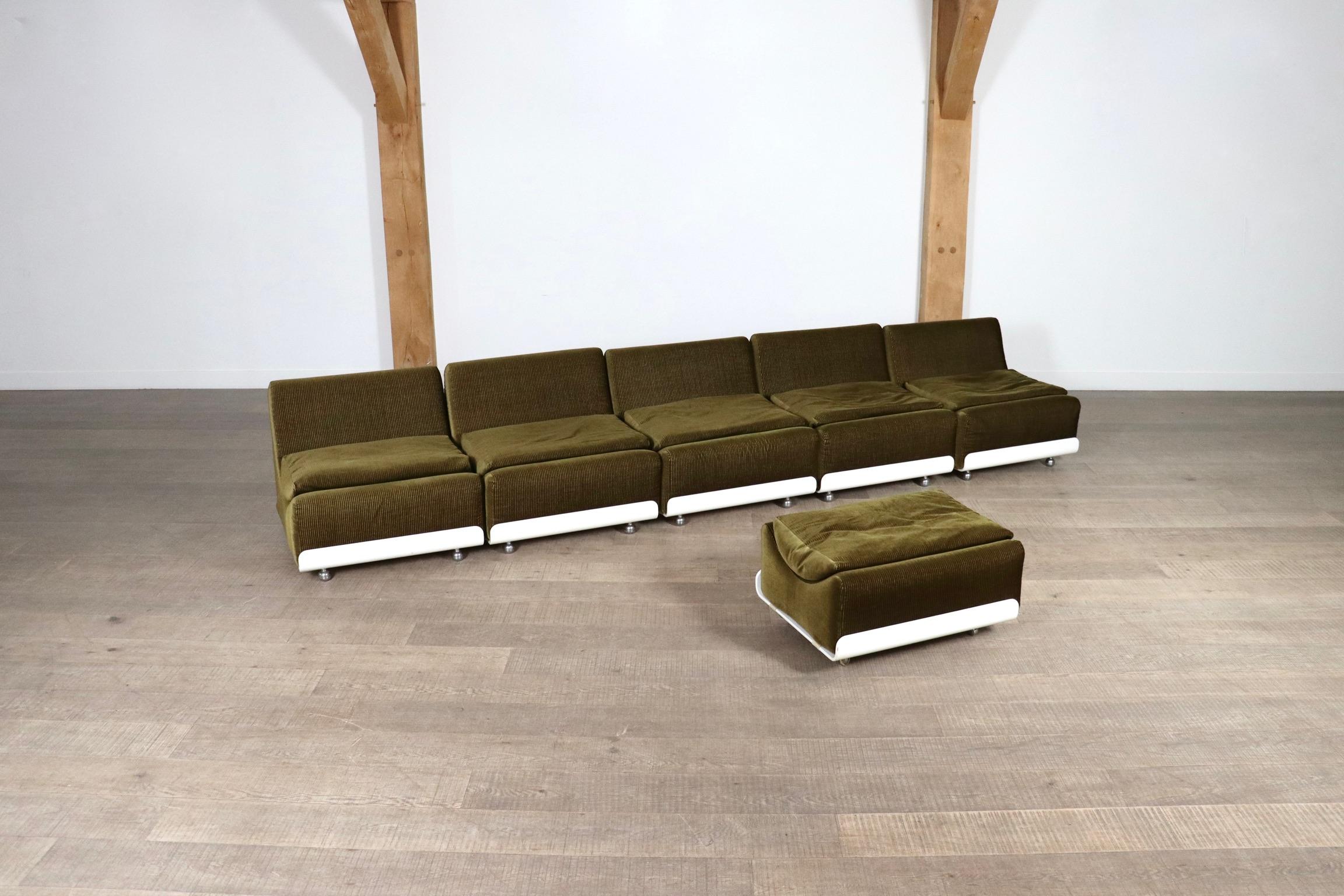 Beautiful modular sofa model Orbis, in original olive green corduroy, white lacquered wooden frame and chrome wheels, which was created in 1973 by Luigi Colani for COR.

The sofa consists of five elements and one ottoman which can be easily moved