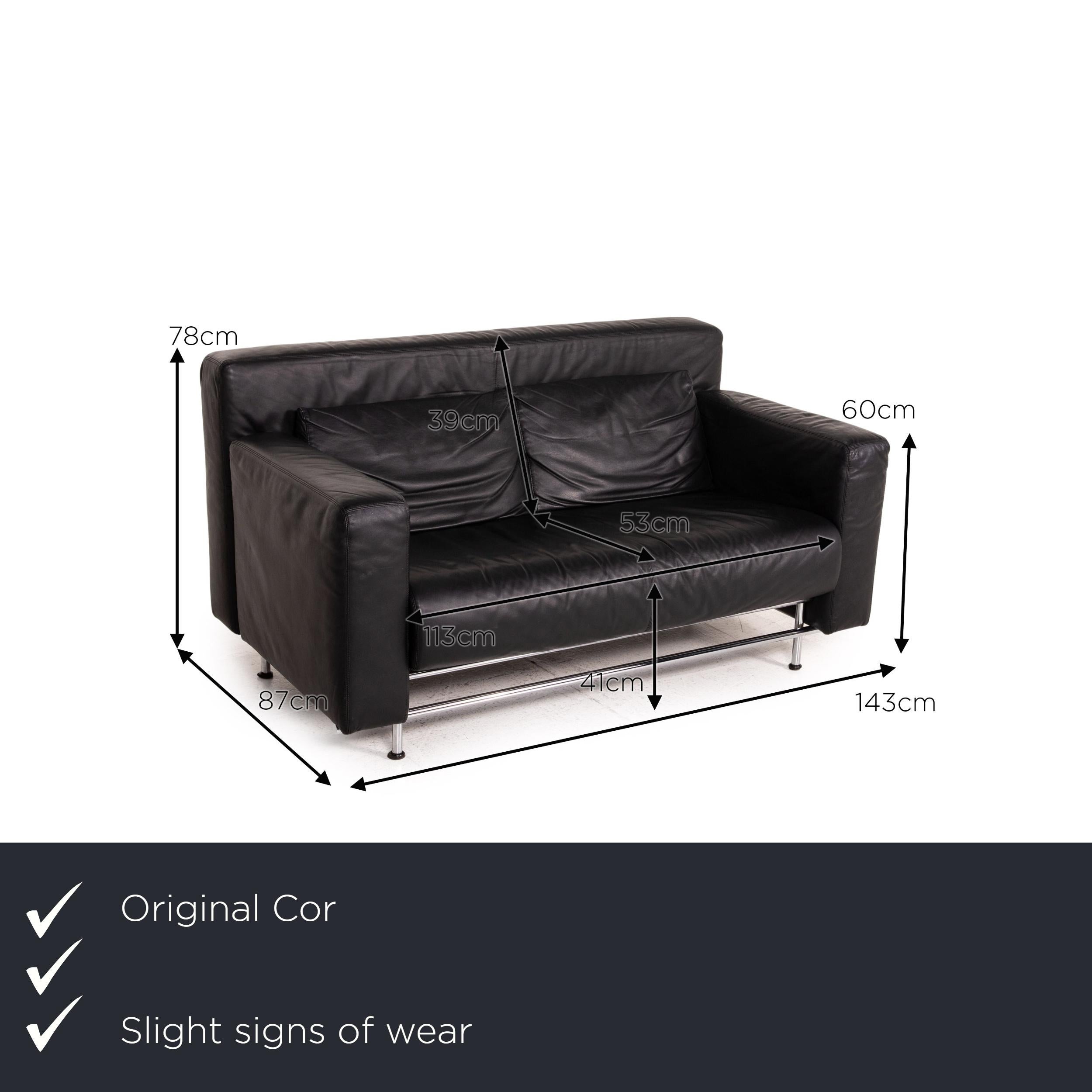 We present to you a COR Quarta leather sofa black two-seater couch.


 Product measurements in centimeters:
 

Depth: 87
Width: 143
Height: 78
Seat height: 41
Rest height: 60
Seat depth: 53
Seat width: 113
Back height: 39.

  