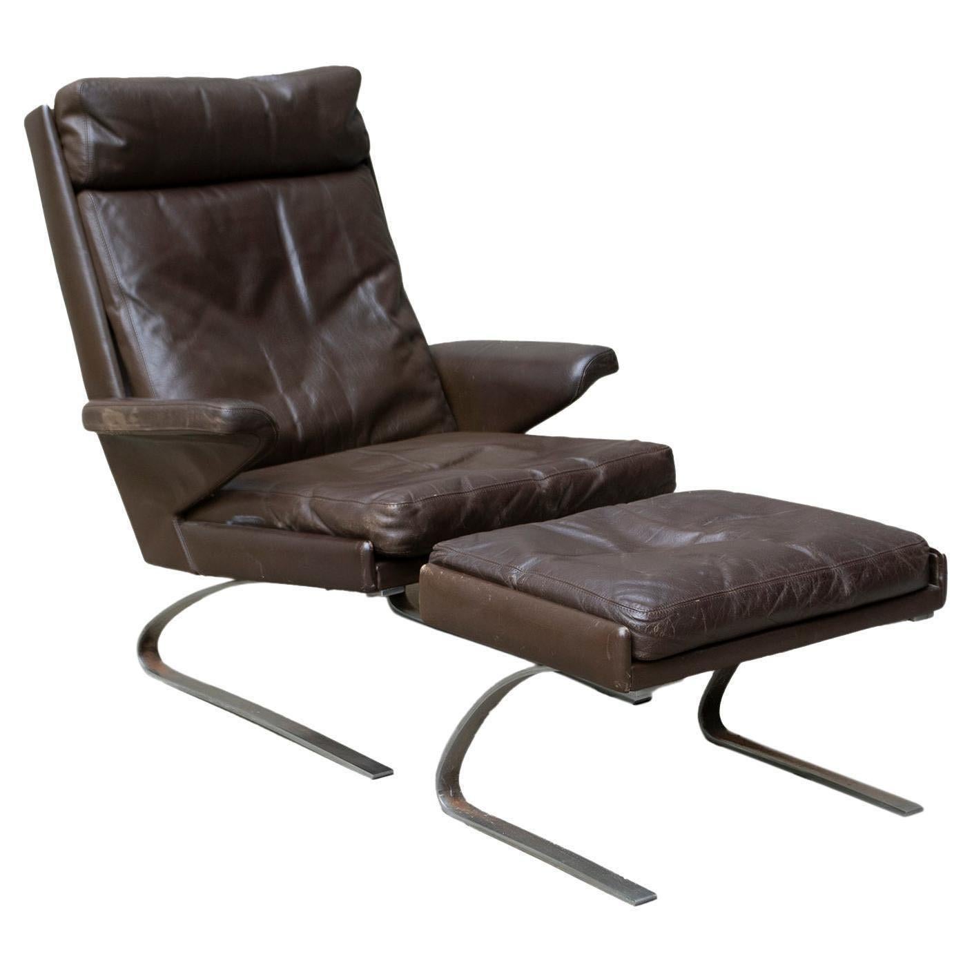 COR Swing Lounge Chair with Matching Ottoman in Leather and Steel Frame For Sale