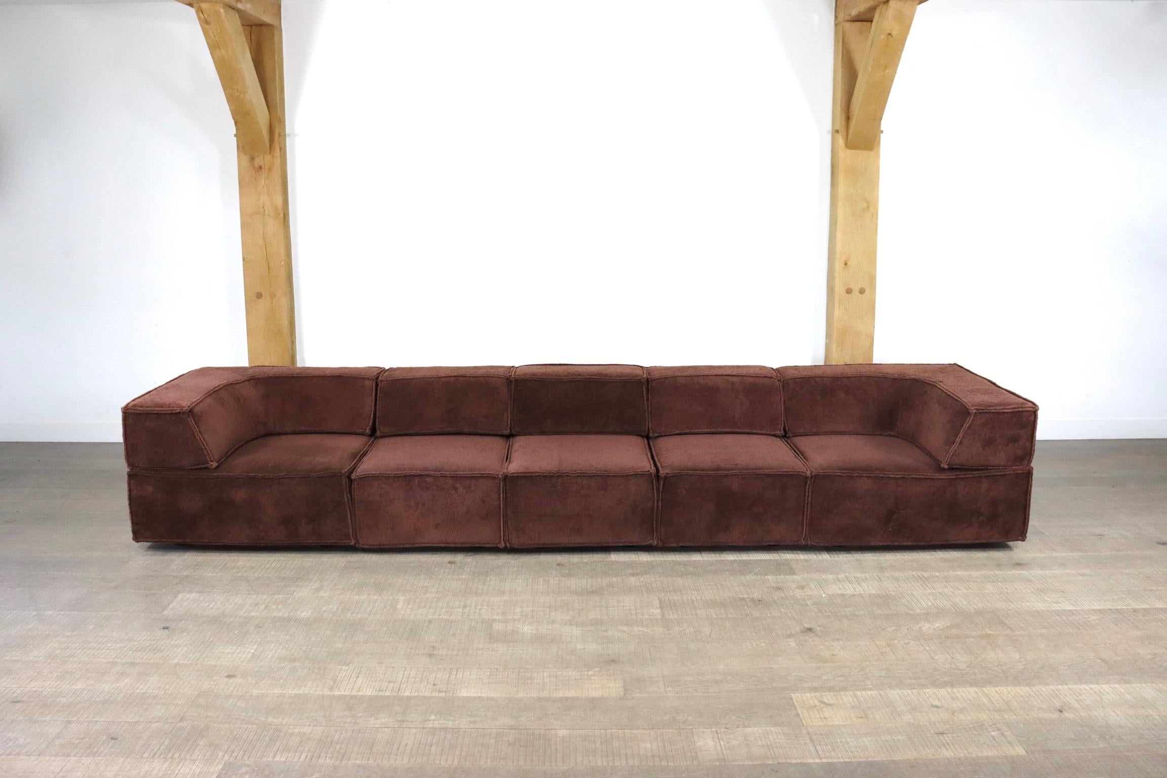 This modular sofa system in stunning brown teddy fabric, which was created in 1972 by Team Form AG in Switzerland for COR, blends seamlessly into any environment. Taking the backrest away it can also be used as a very comfortable bed, and the