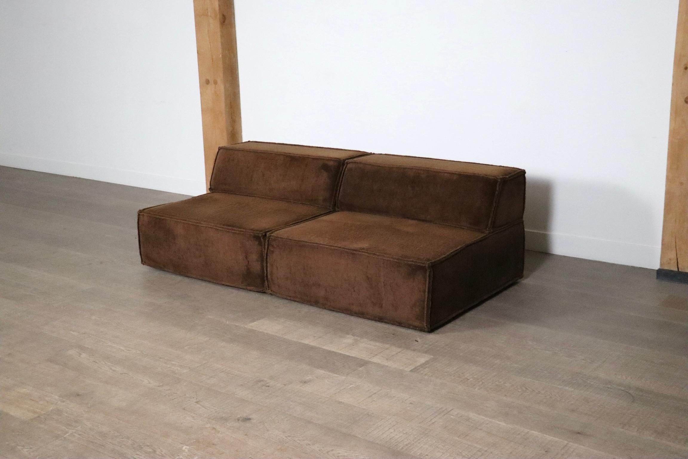 The iconic modular sofa COR trio, executed in the original brown teddy fabric. The Cor Trio design was created in 1972 by Team Form AG in Switzerland for COR, and is still popular today due to its timeless design and high comfort.

This sofa