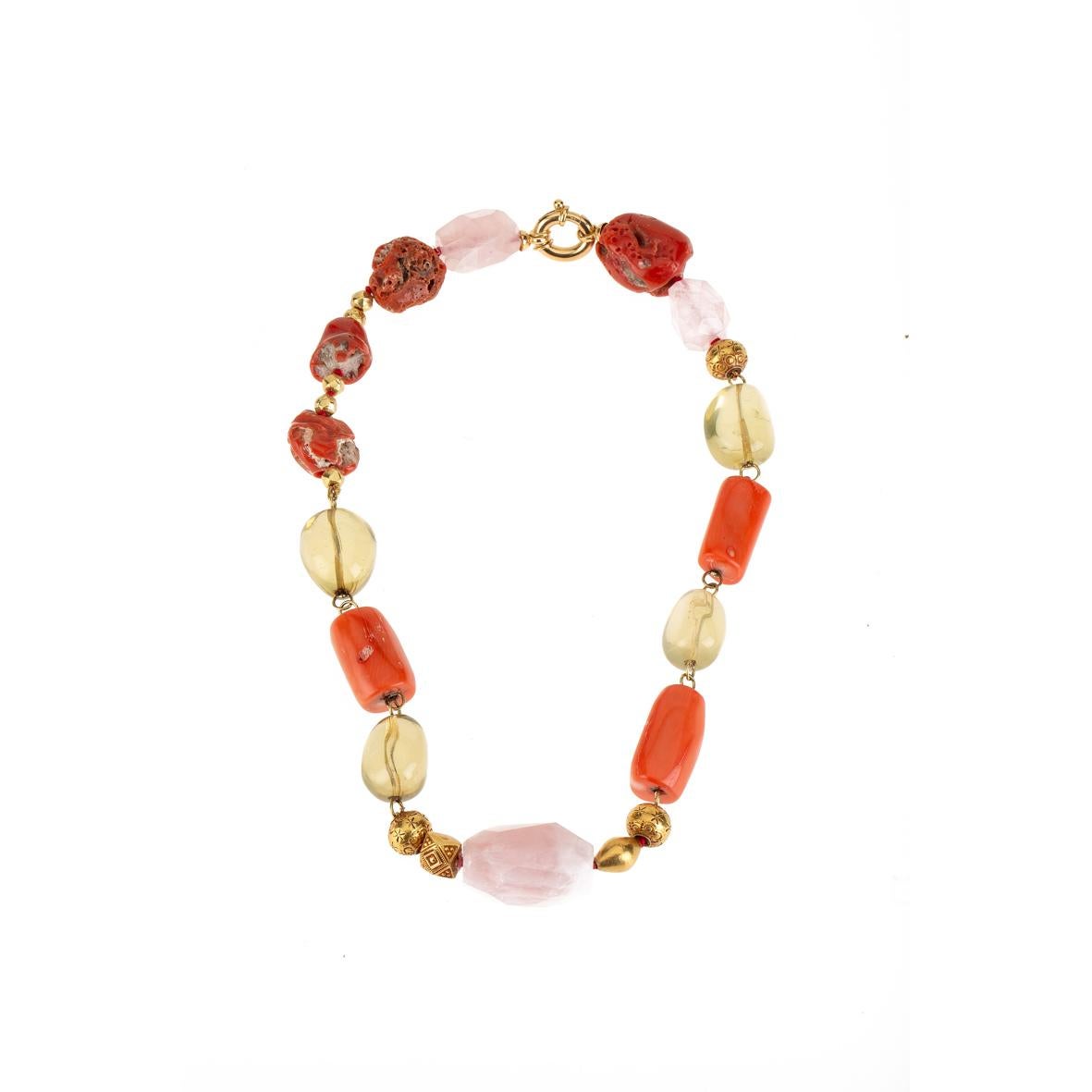 Necklace with orange end red  coral, citrine, antiques Indian  engrave gold beads, faced rose quartz linked in gold 18kt gr. 10,40. Total length 44cm.
All Giulia Colussi jewelry is new and has never been previously owned or worn. Each item will