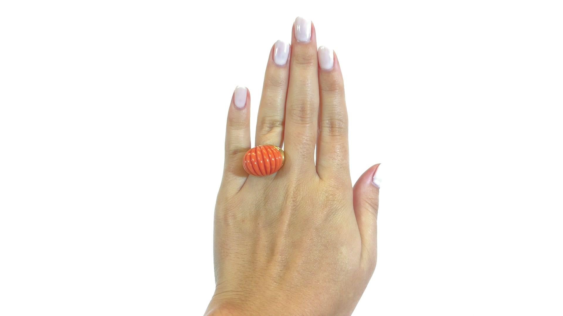 Coral rings always attract the eye due to their vibrant color. Extravagant and glamorous! Wear it for cocktail hour or a lavish evening event. The ring will add a nice eye-catching accent to your look. Carved Coral 18k Gold Dome Ring. Stamped 18k.