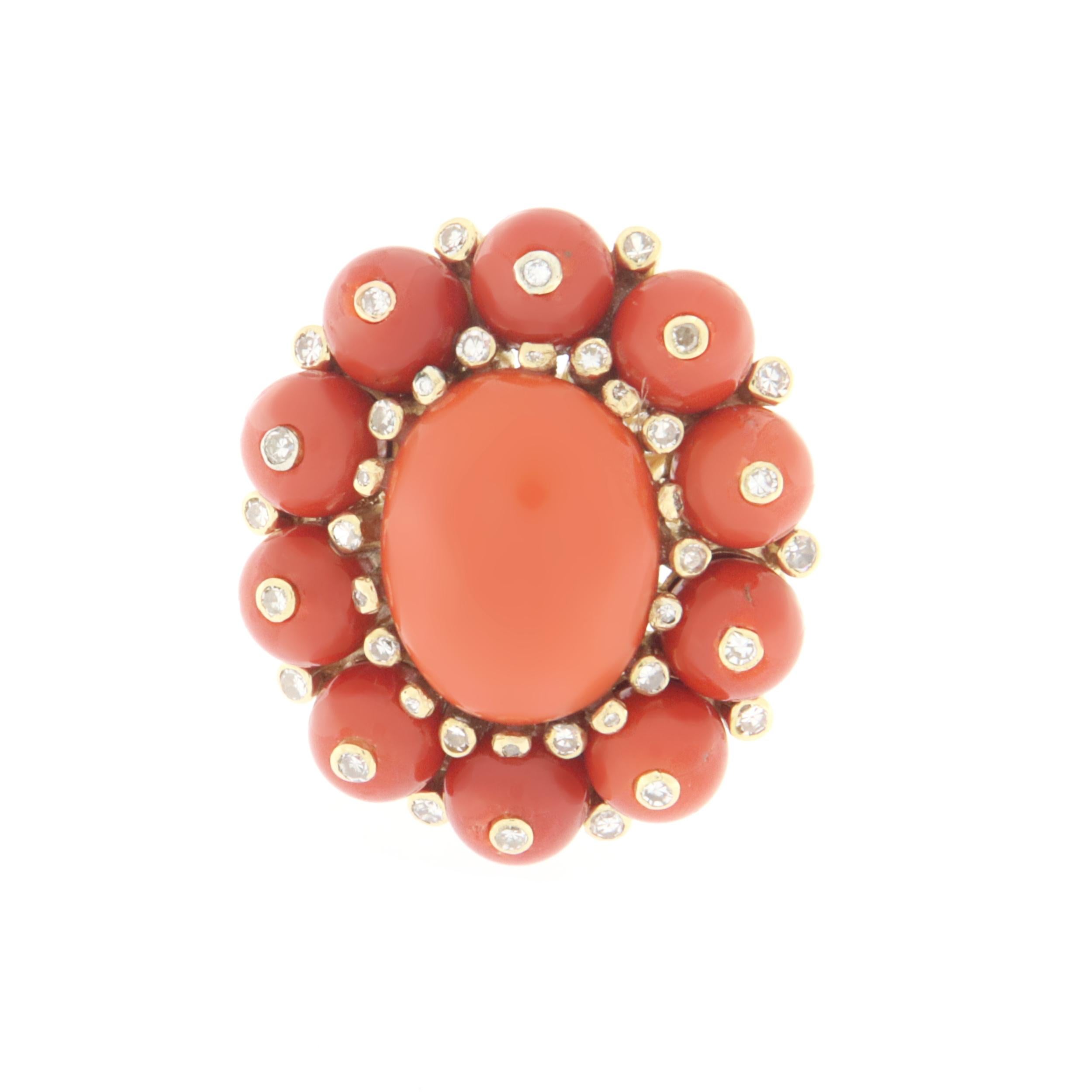 Fantastic 18 karat yellow gold cocktail ring. Handmade by our artisans assembled with diamonds and natural coral

Ring total weight 15.10 grams
Diamonds total weight 0.63 karat
Coral 5.50 grams 
Ring size 8.5 US 18 Ita
(all rings are can be resized)