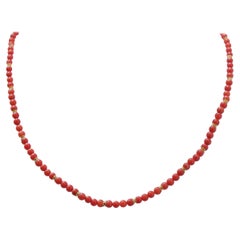 Coral, 18 Karat Yellow Gold.
