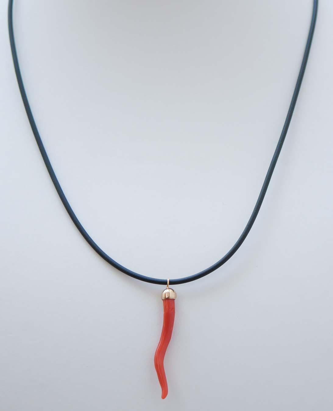 Fashion pendant in 18 kt yellow gold mounted with horn lucky charm of coral. The horn lucky charm is a typical symbol of the ancient Neapolitan culture.
The rubber chain with steel closure is included.
This pendant was totally handmade by Italian