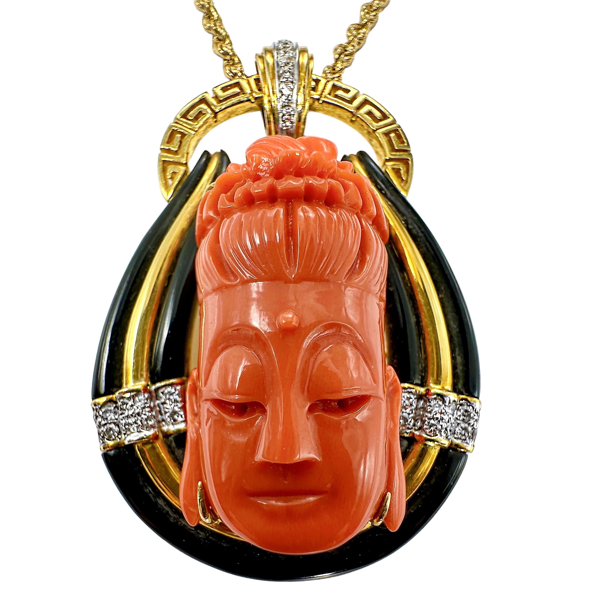 This very finely crafted 18K yellow gold, coral, onyx and diamond pendant was created by Larry Jewelry, a fixture in Hong Kong since the 1960's. This intriguing pendant measures a full 2 1/4 inches in height and 1 1/2 inches in width and is