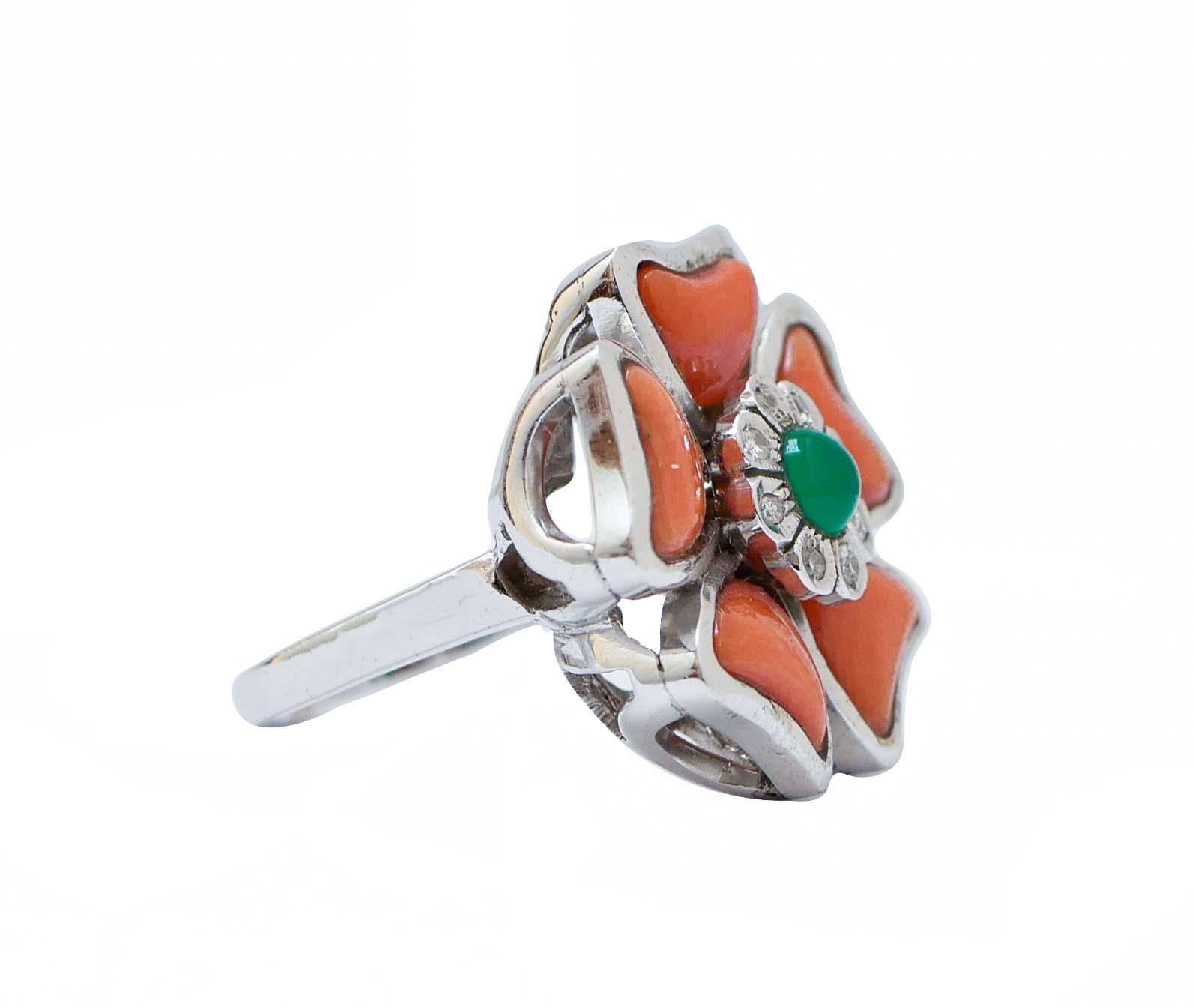 Fashion flower ring in 14 kt white gold structure mounted with coral and a central flower of diamonds and a green agate.
This ring was totally handmade by Italian master goldsmiths and it is in perfect conditions.
Diamonds 0.15 ct
Coral 1.20