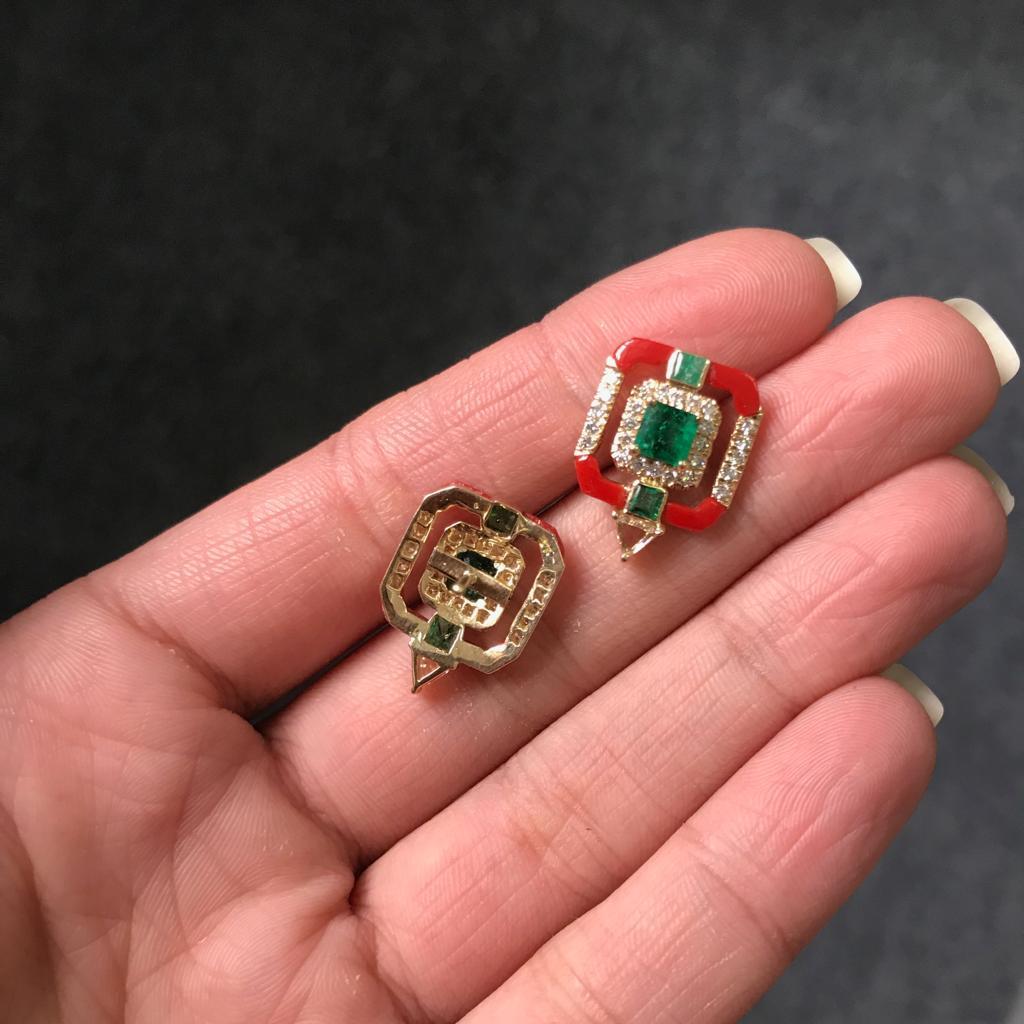 A beautiful, and very unique pair of Italian Coral and Zambian Emerald studs, with white full cut diamonds and a rose cut trillion shaped diamond, all set in 18K Yellow Gold. 