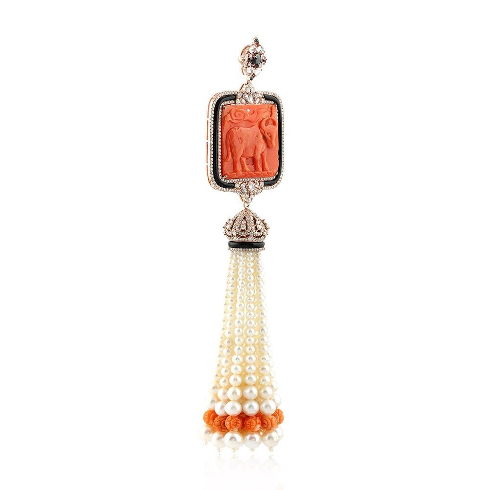 This pretty hand carved bull on coral with fresh water pearl and carved coral tassel pendant in 18K rose gold with diamonds around is one of a kind.  The bayle is openable so you can slide your favorite chian through.

18KT:22.637g
Diamond: