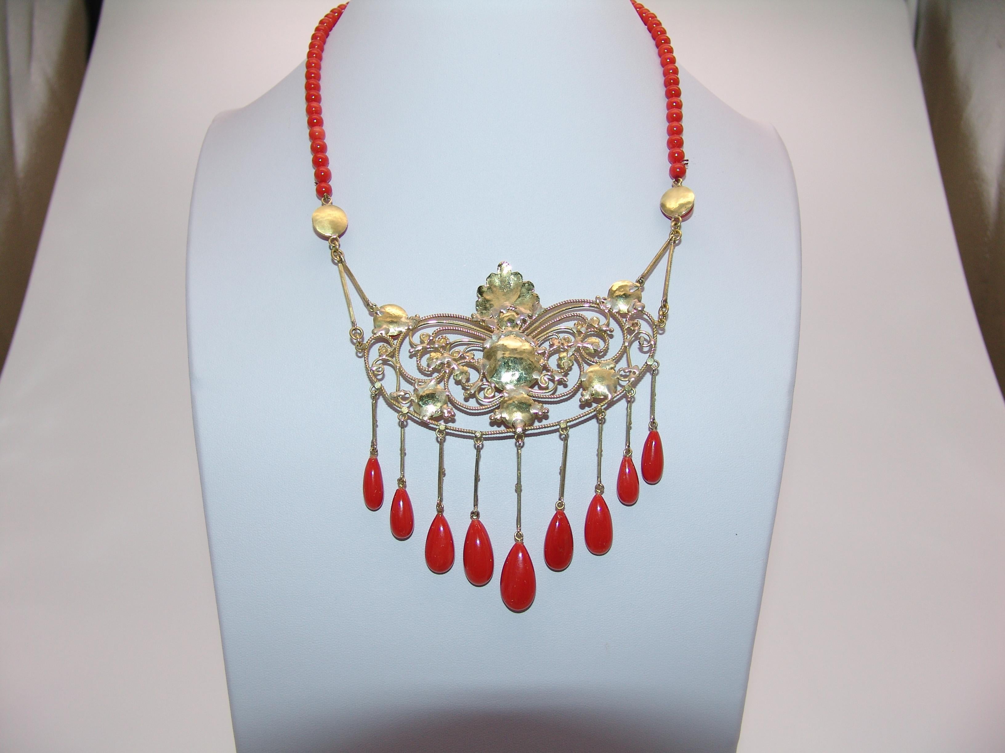 Coral and Gold Necklace with round cabochon and drops.