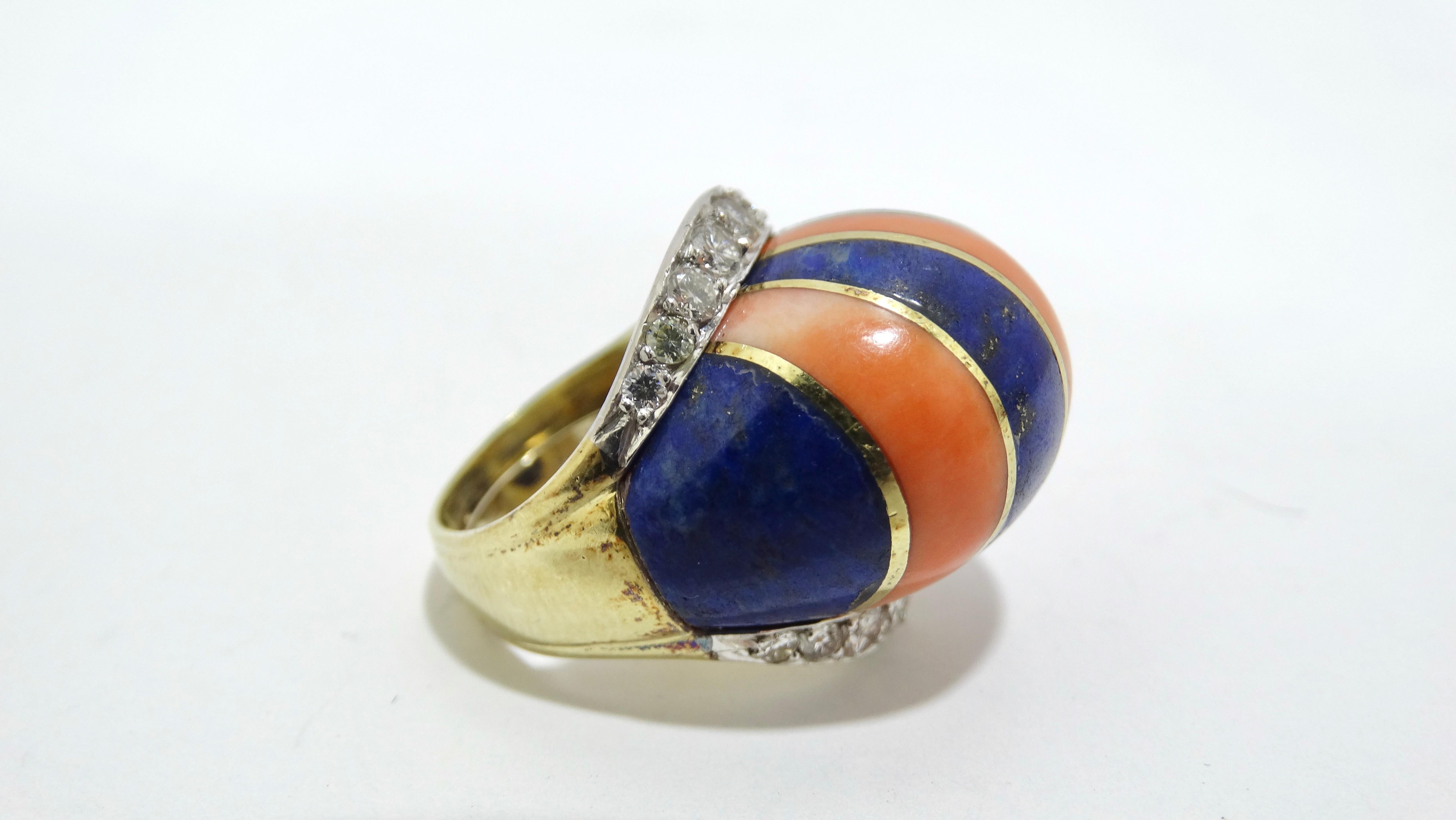 Add a little fun to your ring collection with this unique David Webb style ring. This is a Coral and Blue Lapis striped cocktail ring with two layers of 18 beautiful diamonds featured in 14k gold. It features a clamp on the interior to fit a range