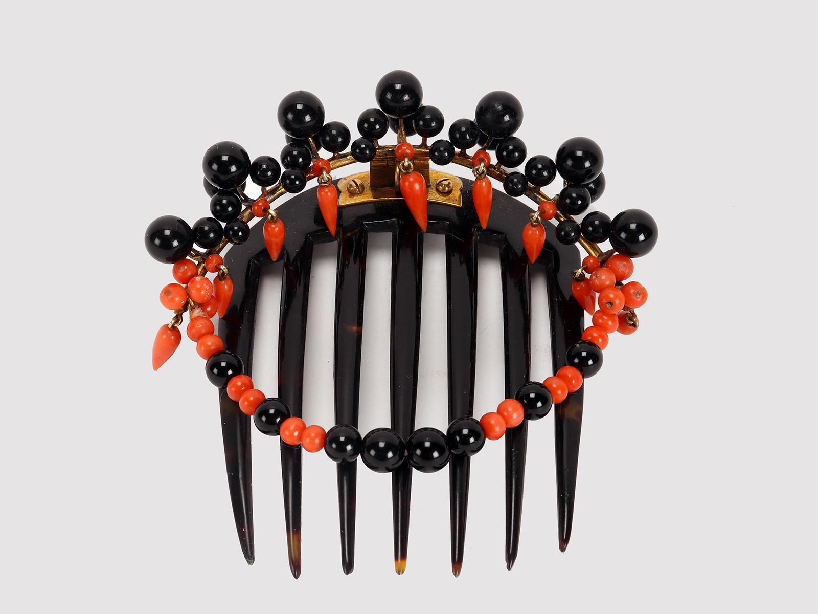 Rare hair comb, diadem, turtleshell, surmounted by a gilt silver element decorated with volutes in an entourage of natural Mediterranean coral pearls (Rubrum Corallium) of an orange-red color and drops, also in coral, with pearls of different sizes