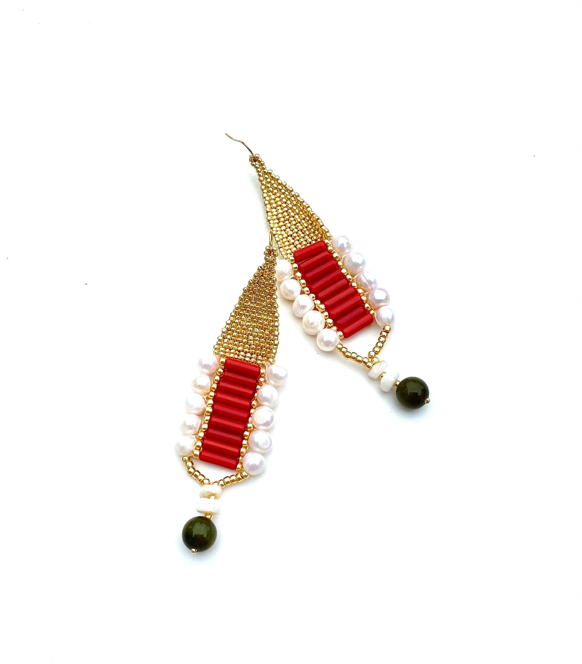 Handwoven permanent 14k gold plated glass seed beads adorned with authentic sustainably sourced red coral tubes, freshwater pearls, conch shell beads and olive-green cats eye glass round bead. 14k Gold plated earring hooks. 
Elegant and bold this