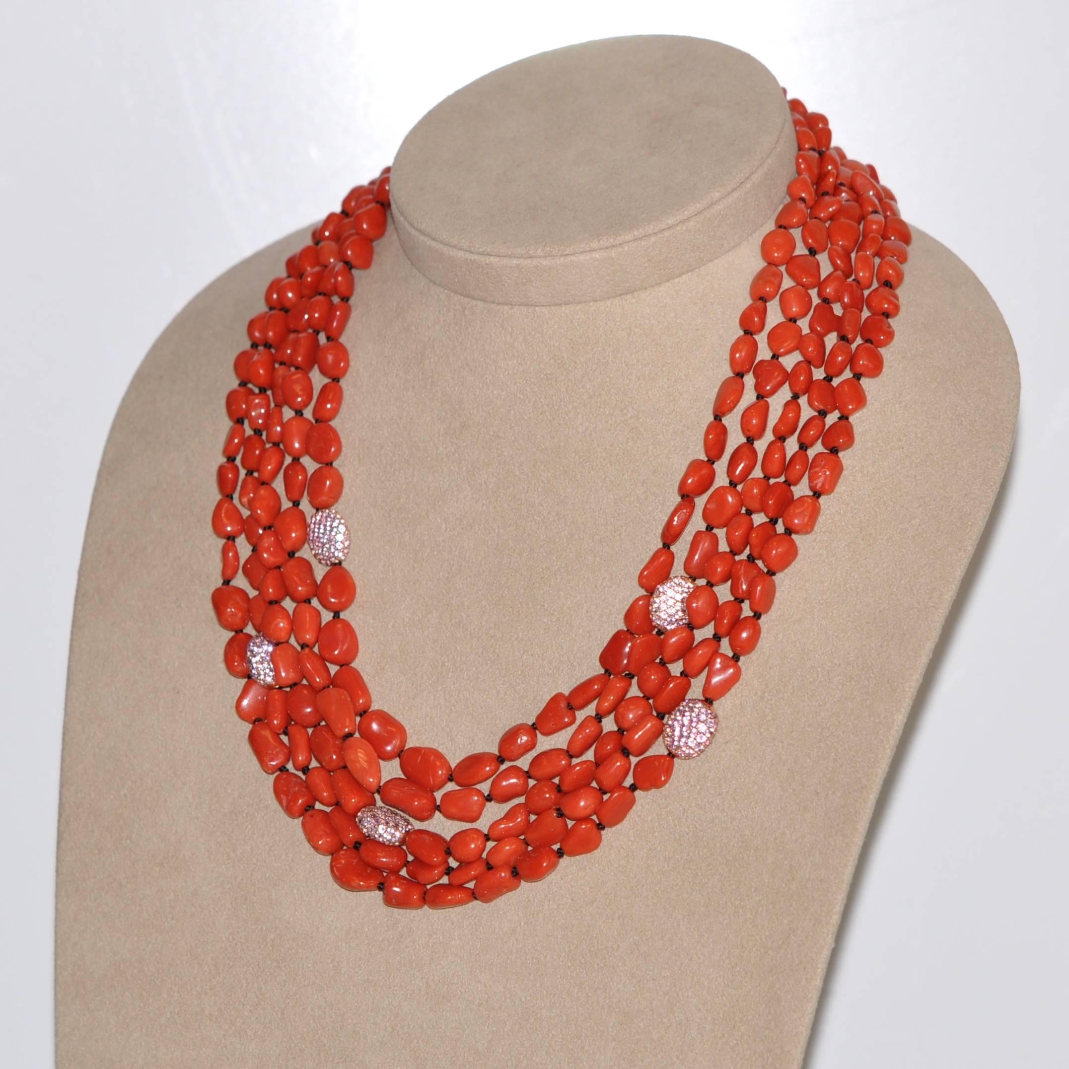 Welcome to the exquisite world of unique, luxurious jewelry. Let us introduce you to our multi-strand necklace in coral, pink sapphire beads and bakelite clasp, an exceptional piece that marries the natural beauty of coral and pink sapphires with