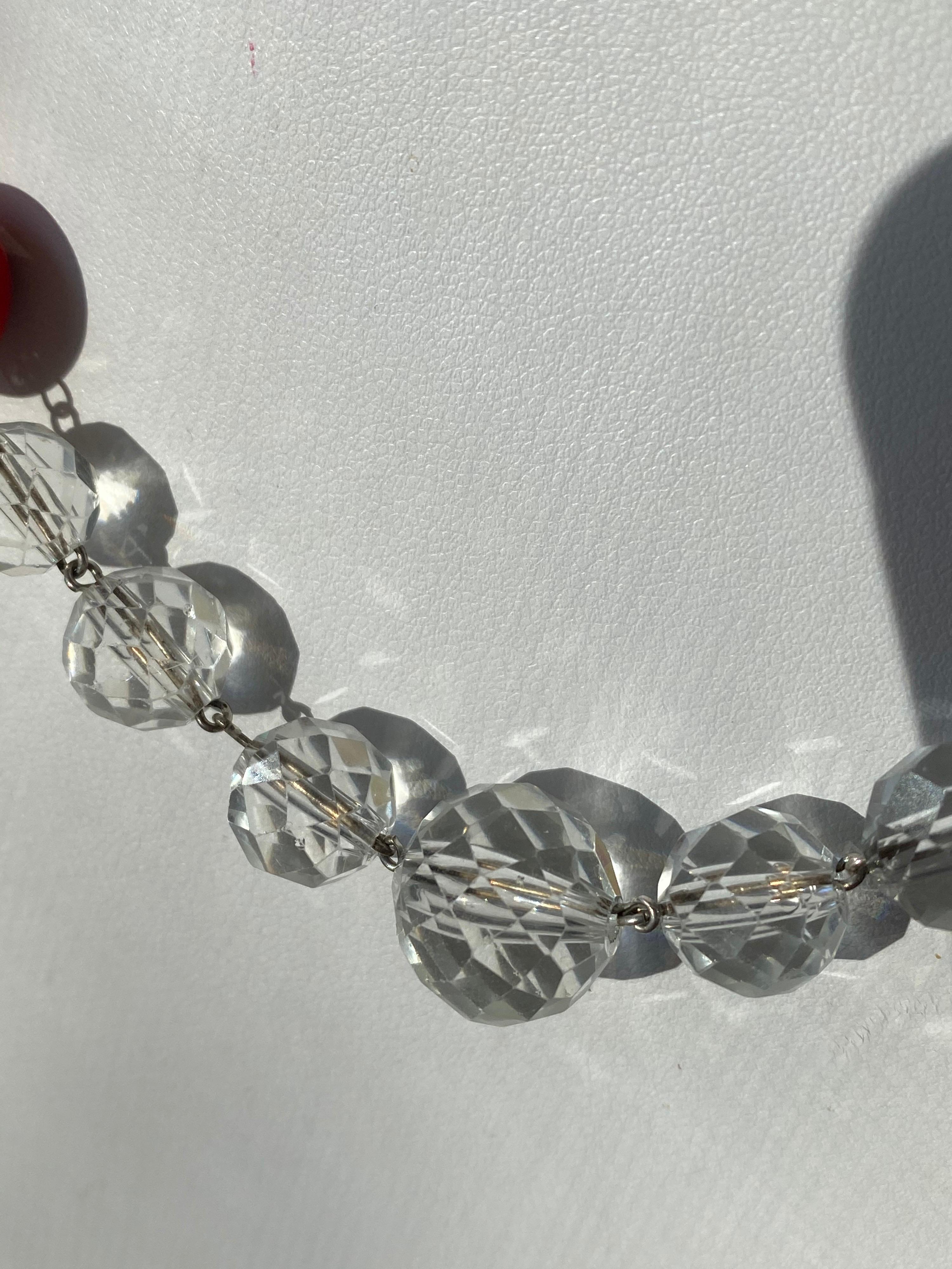 Ladies fashion choker necklace with round coral red beads wire wrapped in Sterling Silver with vintage crystal faceted beads from an old chandelier that comes together with Silver beads and a round Garnet cabochon gemstone bezel set into the