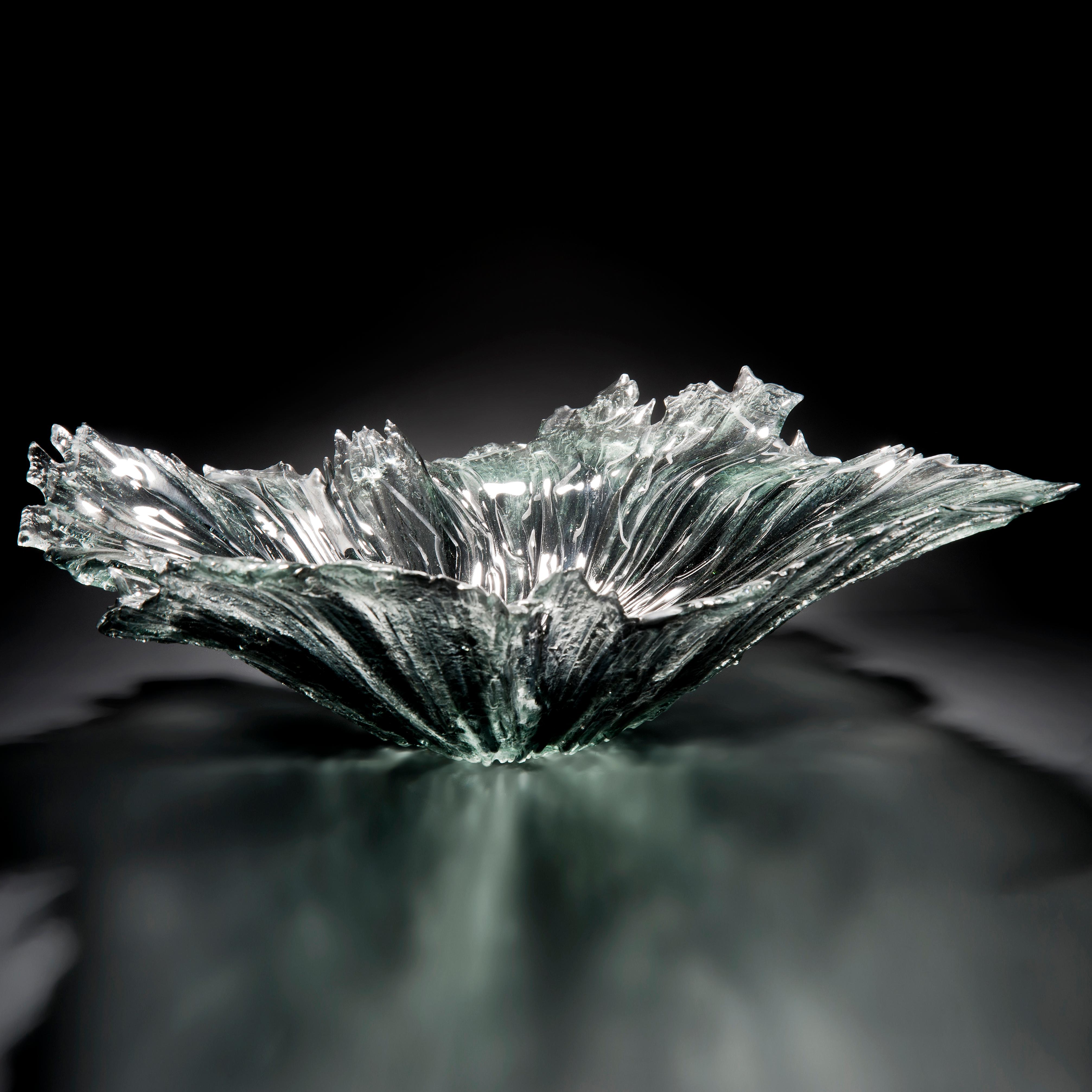 Coral bowl in grey, is a grey and clear glass organic centrepiece / bowl by the British artist Wayne Charmer. Combining drama, movement and scale, the glass resembles an impact splash in to water, simply stunning.

For Wayne Charmer, the fascination