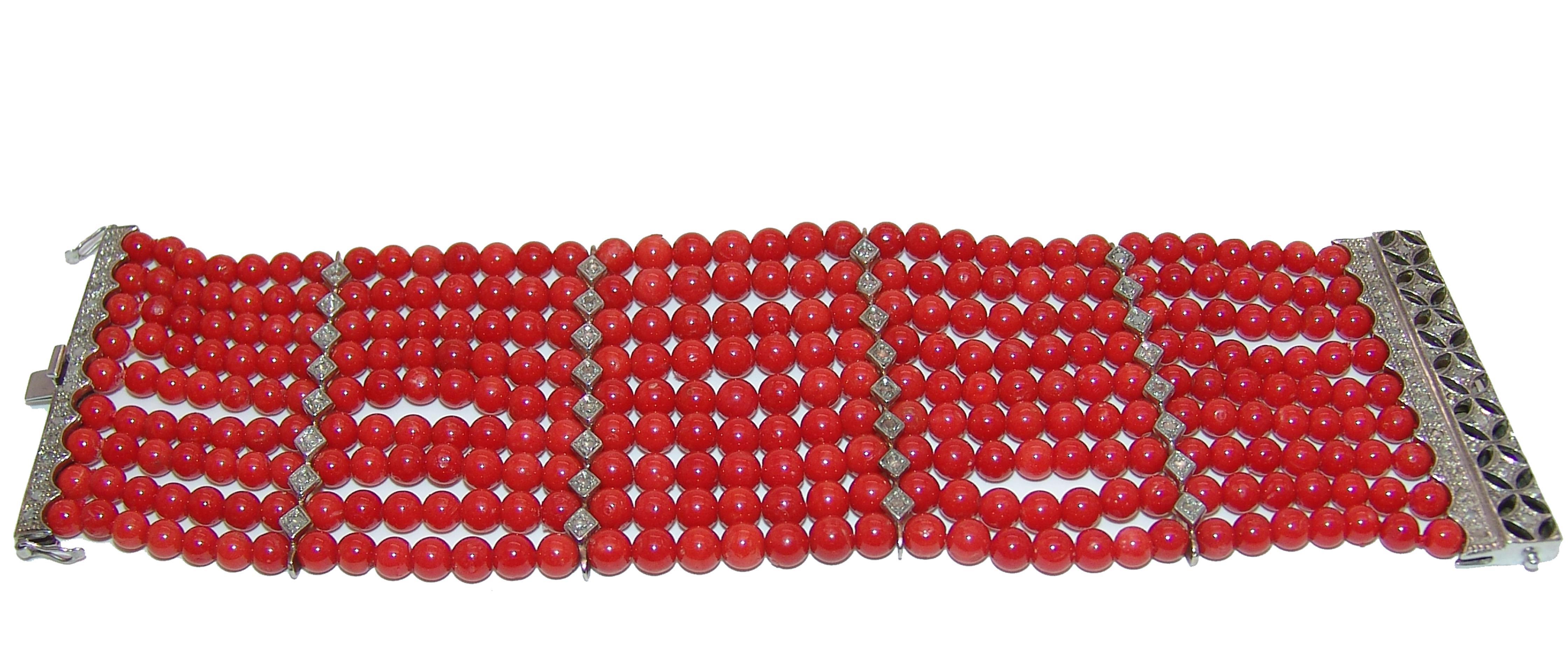 	9 -strand Mediterranean red coral bracelet with gold clasp and bars spacers,gold is 9kt.
 total weight is 113 gr .All made by hand in Italy.
