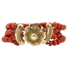 Coral bracelet with gold clasp, mid-20th century.