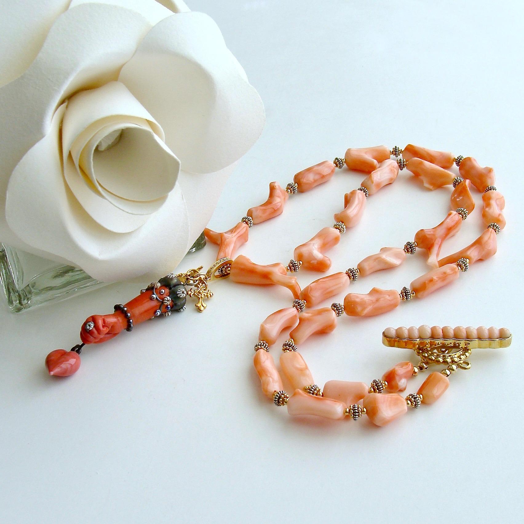 Cordelia Necklace.

A gorgeous suite of  delicate coral branch beads is accented with gold vermeil daisies and oxidized silver mixed metals to add  interest and gently separate each of the coral branches.  A stunning hand and heart lamp work glass