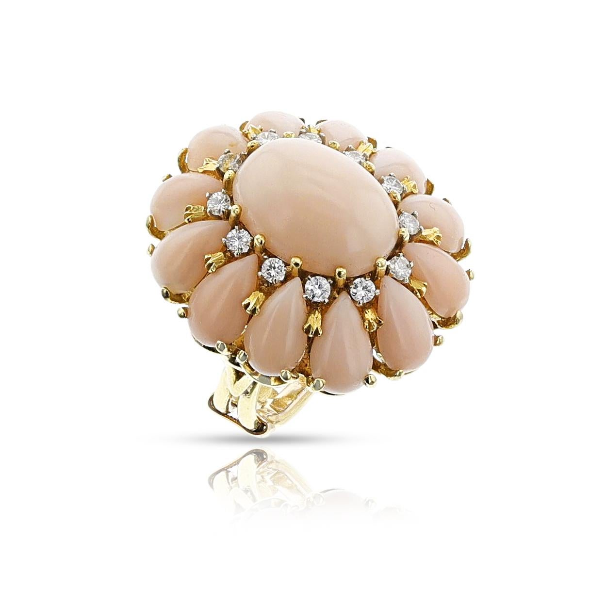 A Coral Cabochon and Diamond Floral Cocktail Ring made in 18k Yellow Gold. The ring size is US 5.50. The total weight of the ring is 15.13 grams. 