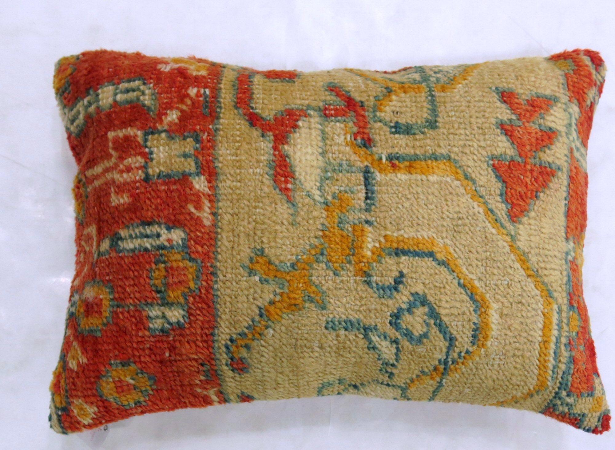 Pillow made from an early 20th century coral and camel color antique Oushak rug

Measures: 16