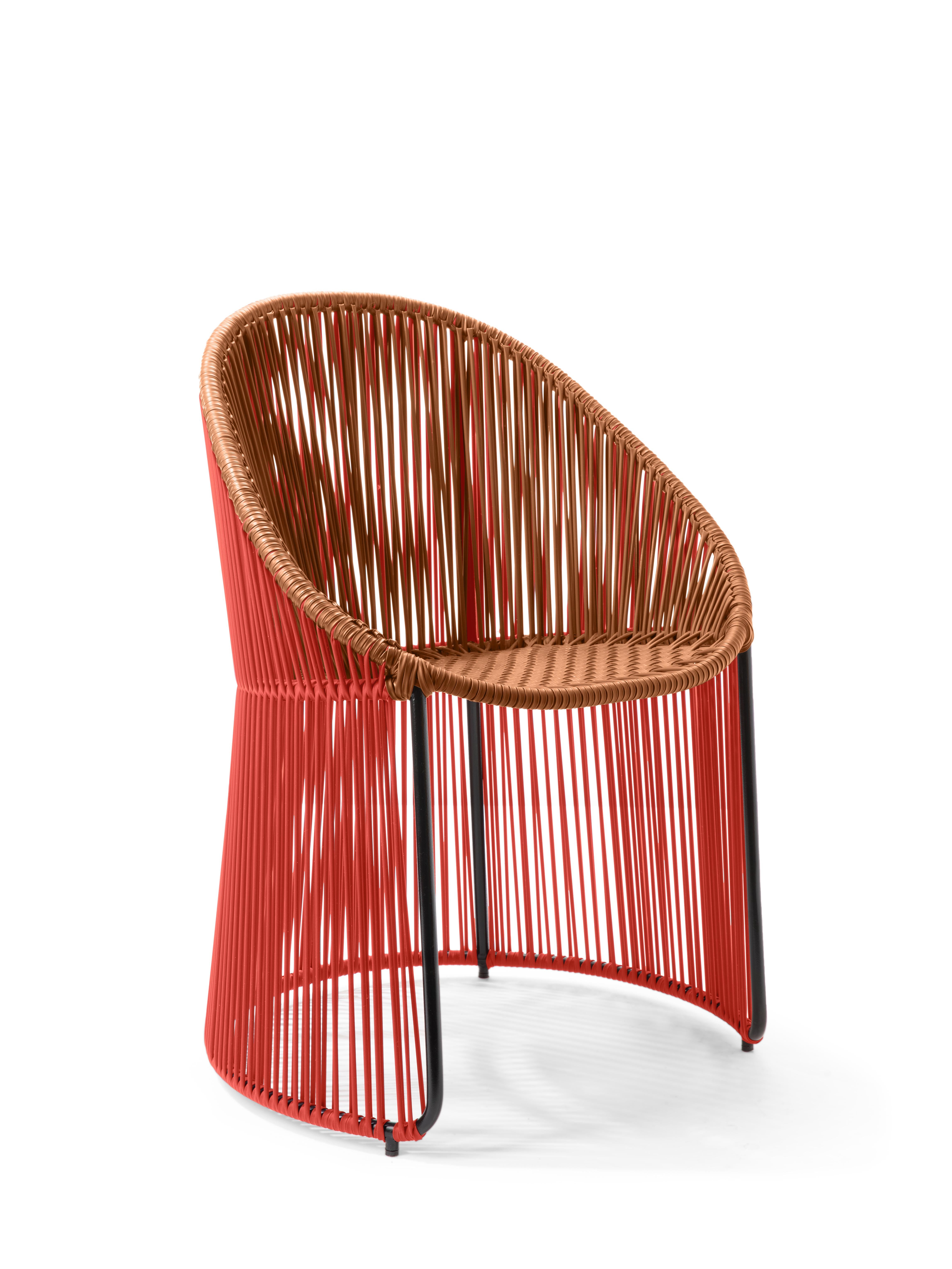 Coral/caramel cartagenas dining chair by Sebastian Herkner
Materials: PVC strings. Galvanized and powder-coated tubular steel frame
Technique: made from recycled plastic. Weaved by local craftspeople in Colombia. 
Dimensions: W 60.2 x D 53.8 x H