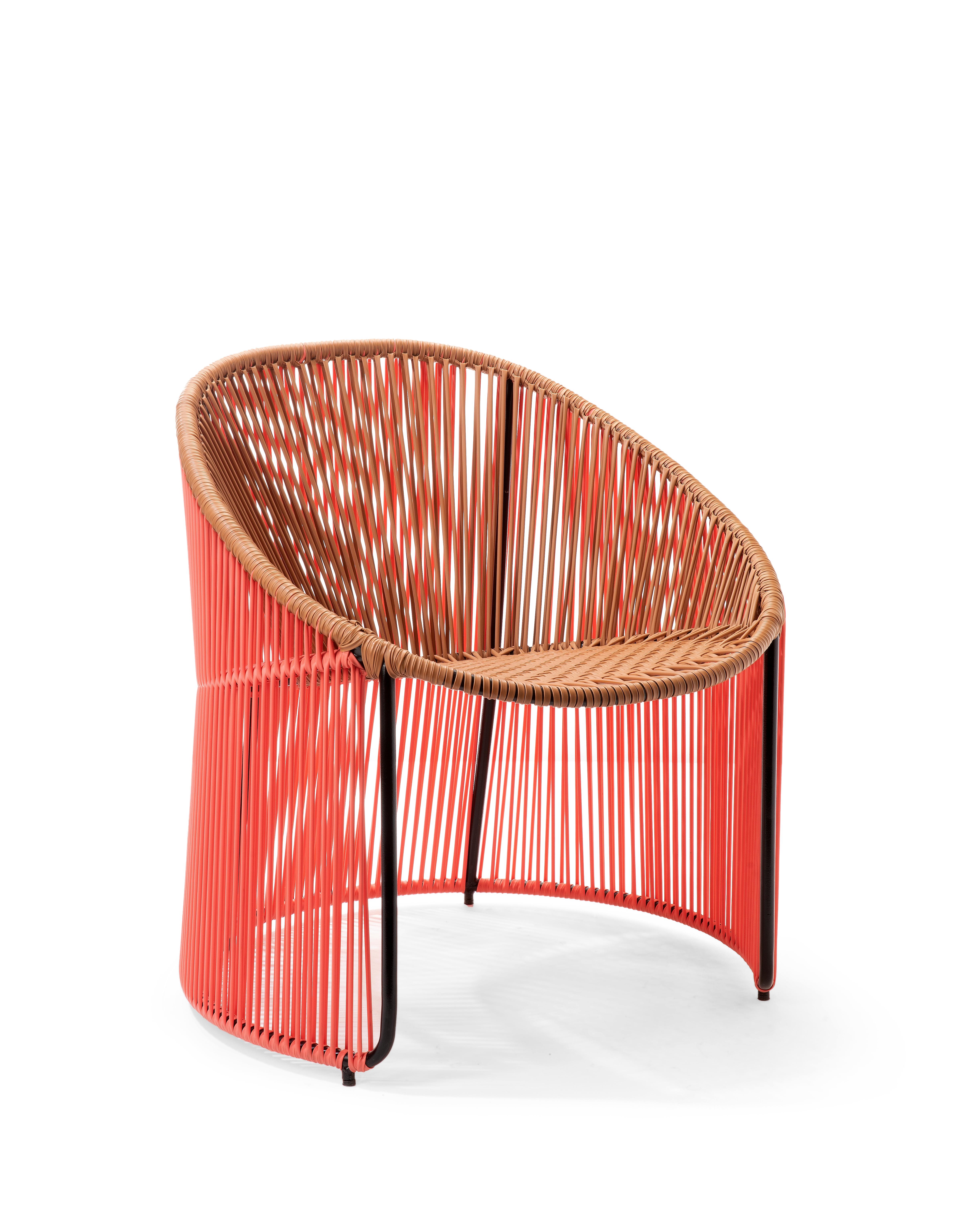 Coral Cartagenas lounge chair by Sebastian Herkner
Materials: PVC strings. Galvanized and powder-coated tubular steel frame
Technique: made from recycled plastic. Weaved by local craftspeople in Colombia. 
Dimensions: W 64 x D 70 x H 74 cm
