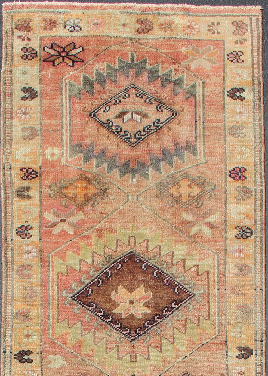 Hand-Knotted Coral colored Vintage Oushak Runner with Geometric Medallions For Sale