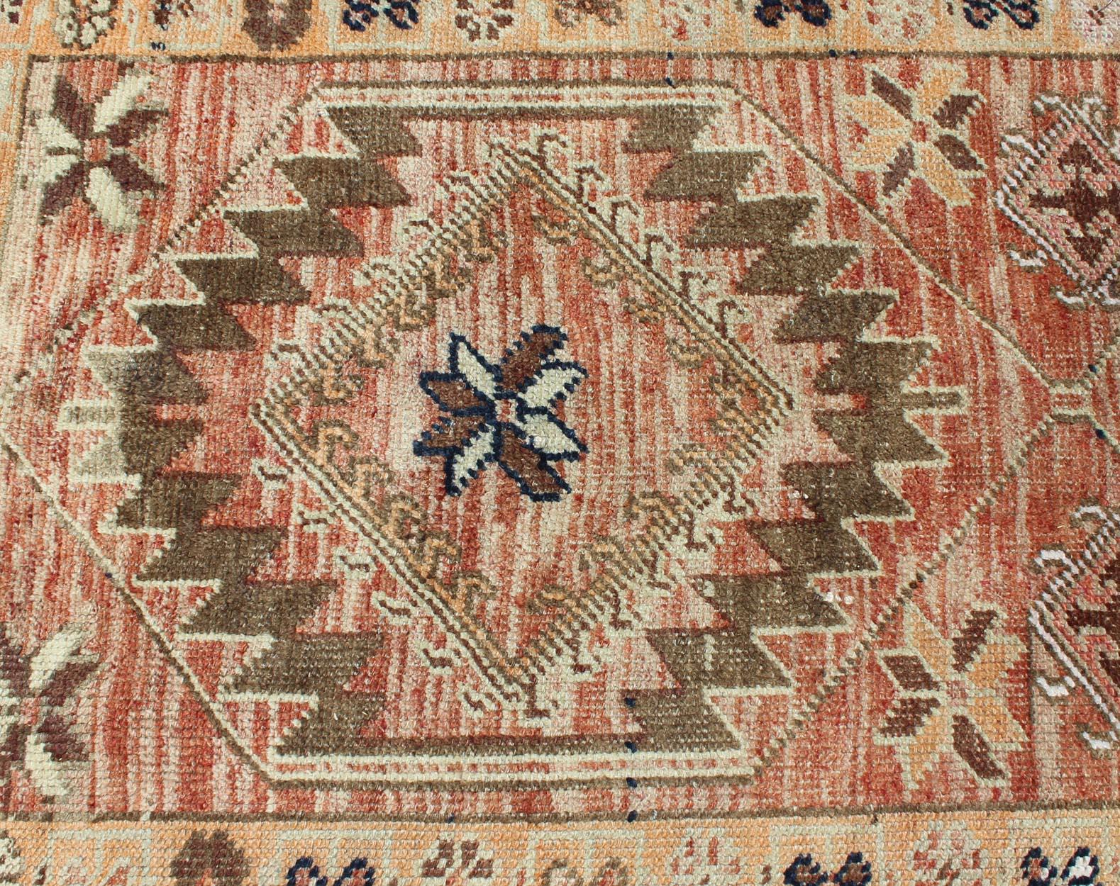 Mid-20th Century Coral colored Vintage Oushak Runner with Geometric Medallions For Sale