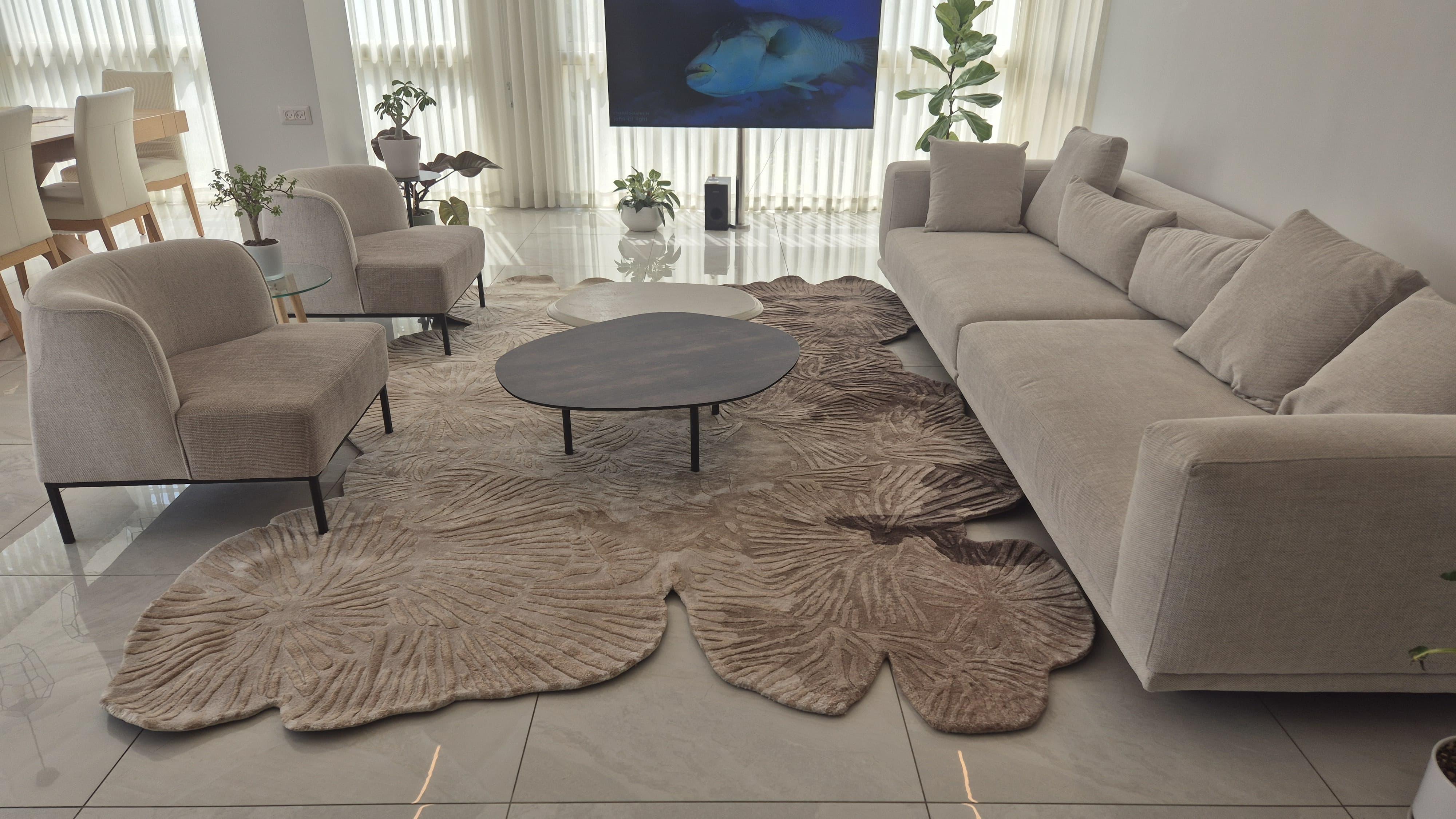 CORAL was born from observing the slow flow of time—like sediment forming strata, like light settling into matter. Its asymmetrical composition in hues of blue-amber, sand, and deep gold creates an organic structure that gently unfolds in a space,