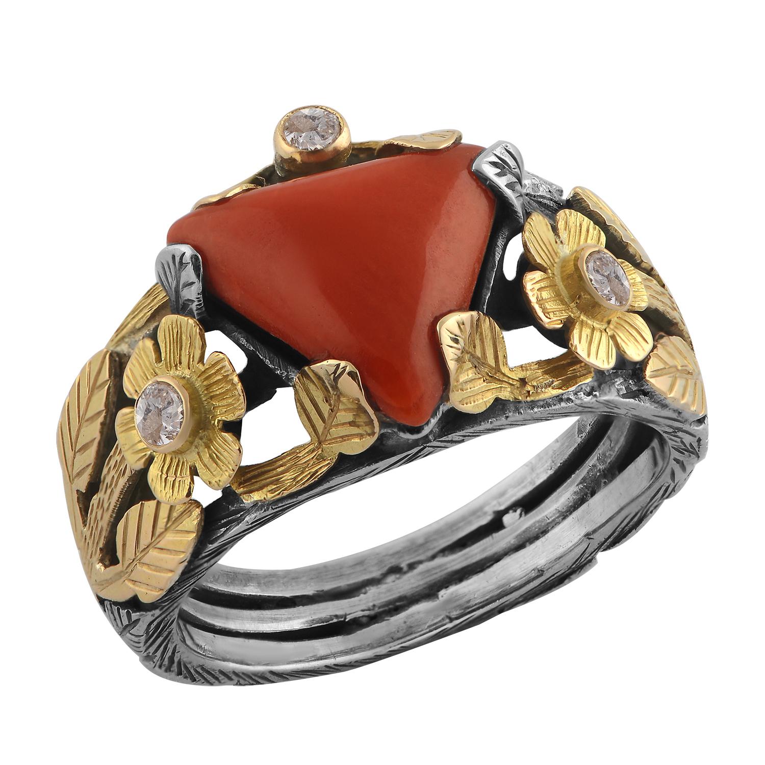 

This beautiful one of a kind ring has been handmade in our workshops. It has exquisite hand engraving work on it using 18kt gold and oxidized sterling silver botanical motifs. The ring is embedded with coral and diamonds.

It has a matching