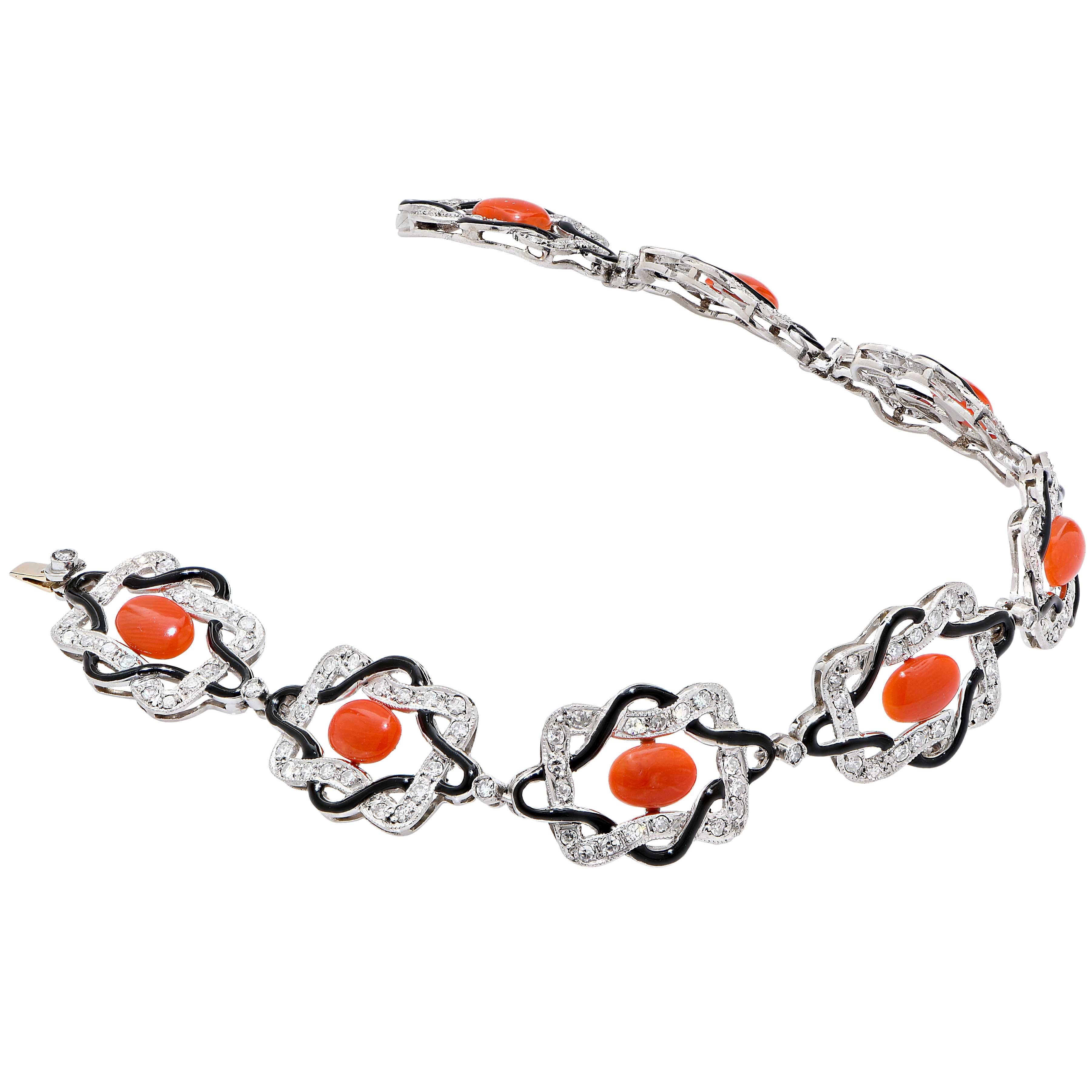 Vintage Coral, Diamond and Enamel Platinum Bracelet features 8 oval cabochon cut coral pieces and 152 single cut diamonds with an estimated total weight of 1.5 carats.
Bracelet Length: 7 1/8 inches
Metal Type: Platinum
Metal Weight: 16.5 Grams