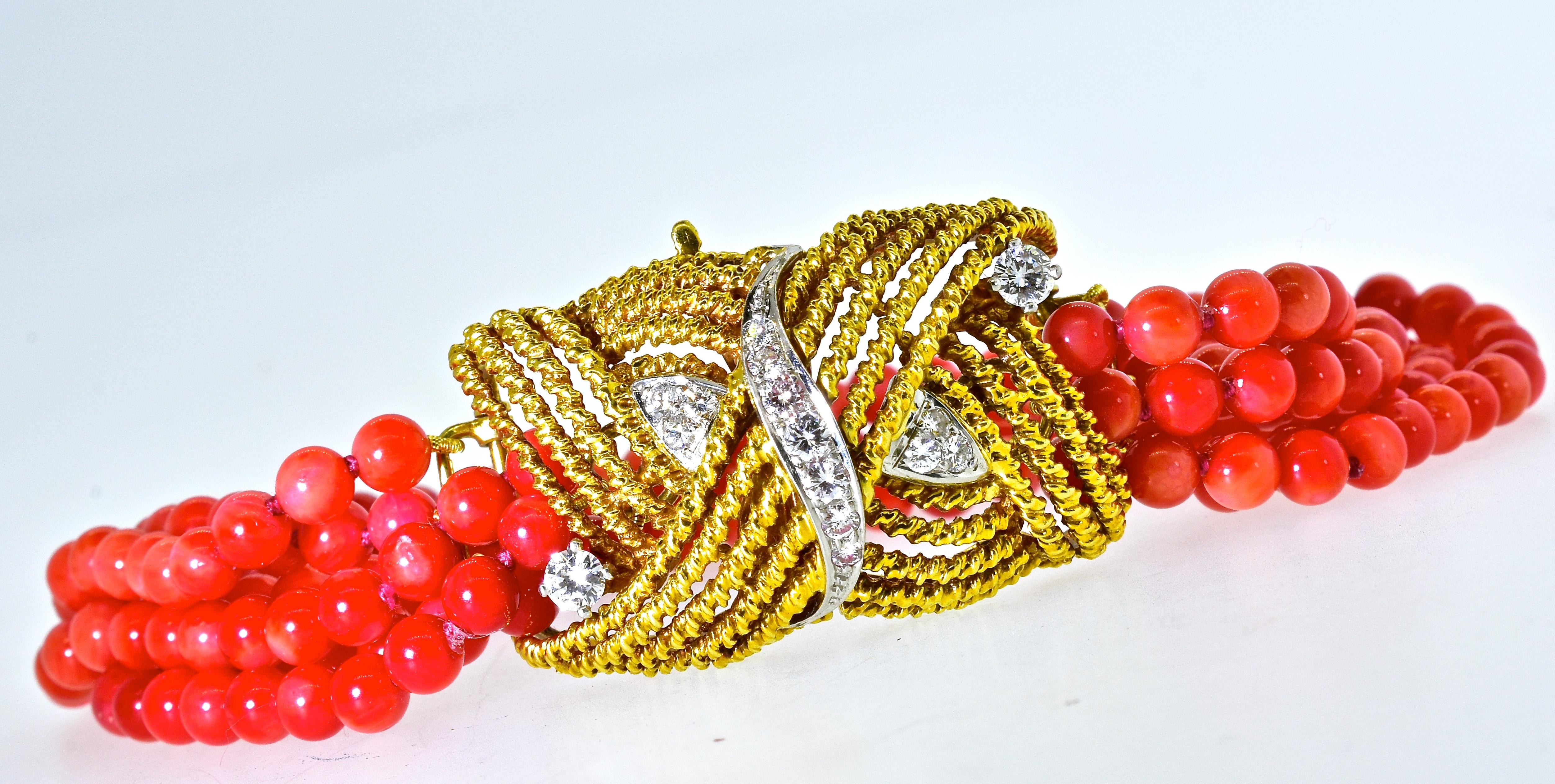 Coral beads, bright red/orange come together with an elaborate  18K gold  twisted motif clasp. Fine white diamonds are set through out in platinum, these diamonds are estimated to weigh .68 cts., they are H/I in color (near colorless), and very