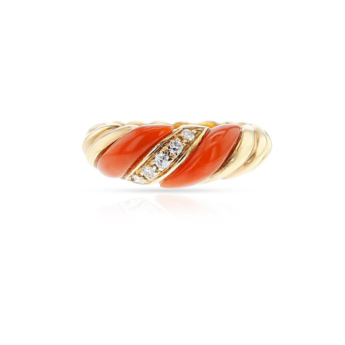 A Coral, Diamond and Gold Twisted Ring, 18k. The total weight of the ring is 5.70 grams. The ring size is US 5.25.

SKU: 1115-CJARTYU.