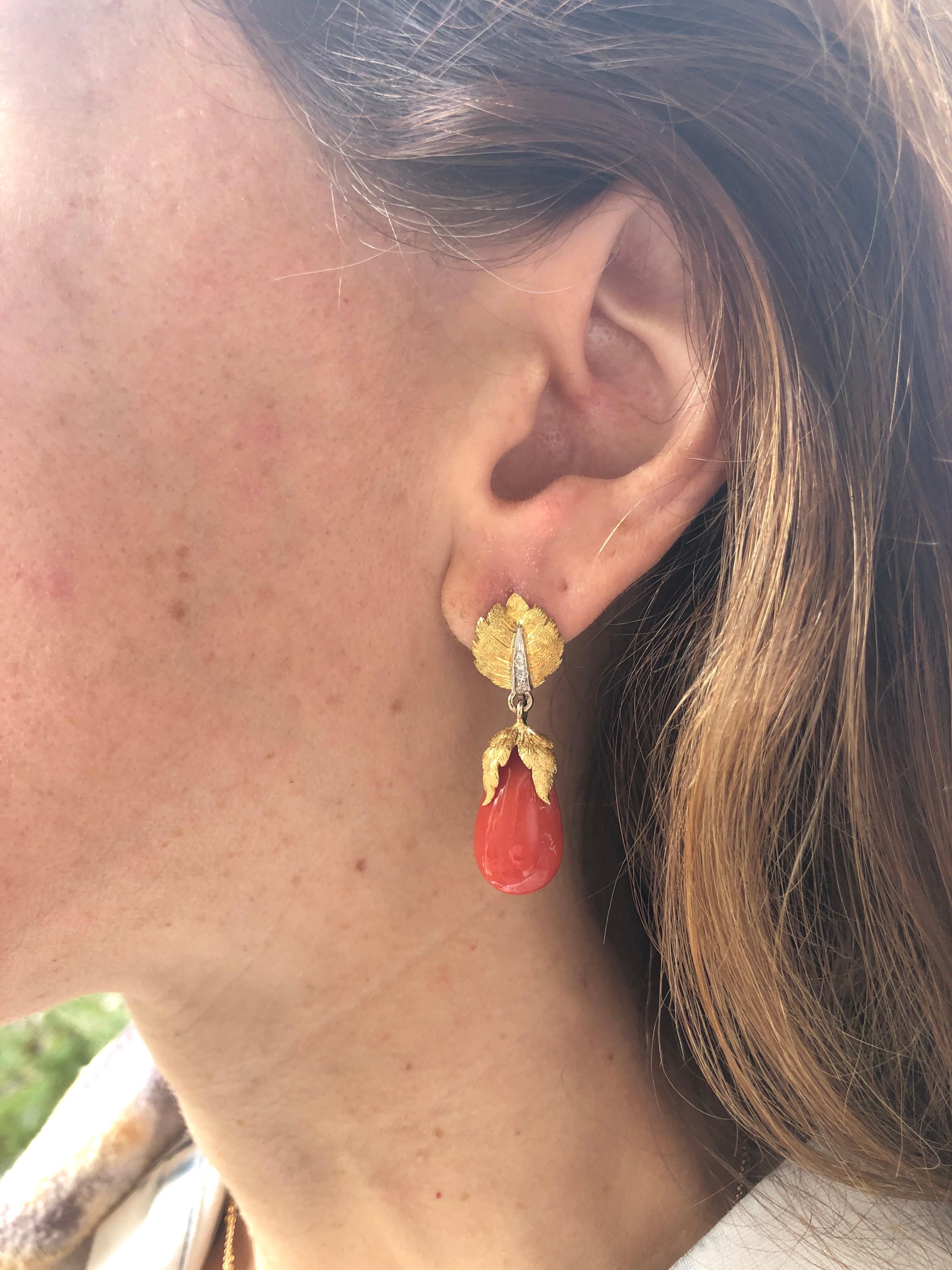 Exceptional Coral and diamond earrings, hand engraved in the traditional Florentine style.
The Corals weigh a total of approximately 4 carats and the diamonds weigh a total of 0.08 carats.
Crafted in 18K yellow and white gold.
The total length is