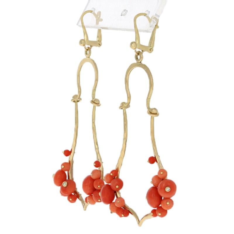Metal Content: Guaranteed 18k Gold as stamped

Stone Information: 
Genuine Coral Beads

Natural Diamonds  
(six small accents)
Cut: Round Brilliant 

Style: Dangle
Fastening Type: Leverback Closures
Measurements: 2 27/32