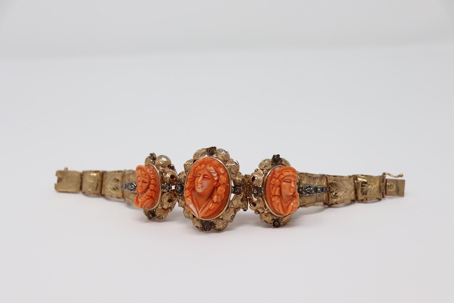 Rare beautiful retro bracelet in rose gold 9 Kt with diamonds. Gold is finely engraved by hand. The three large red coral cameos carved by hand in relief figures are of great value. High quality Italian goldsmith bracelet. Provenance private