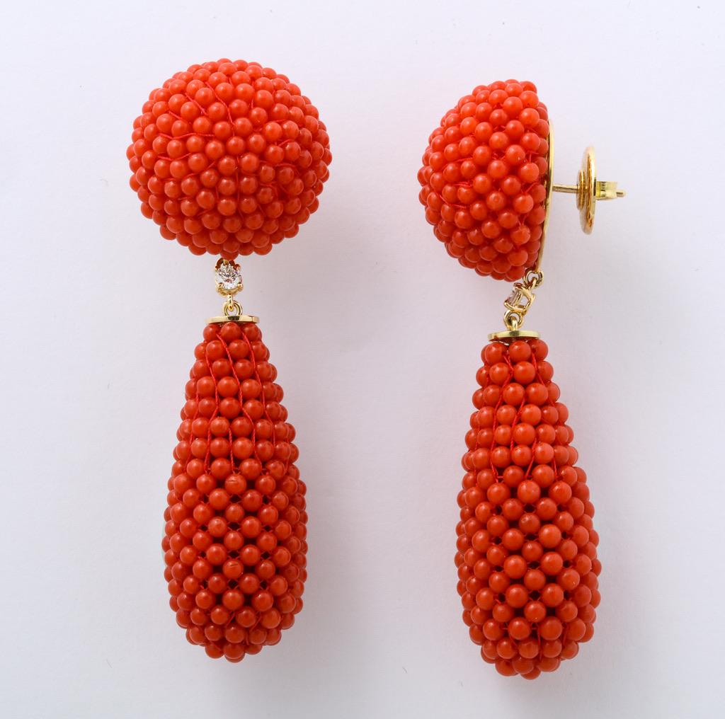 Beaded coral button and drop earrings, mounted in 18kt gold with a round diamond connection.
For pierced ears.
Total length 2.75 inches (7cm).
Made in Italy.
Complimentary delivery by Federal Express Priority Service for maximum convenience.