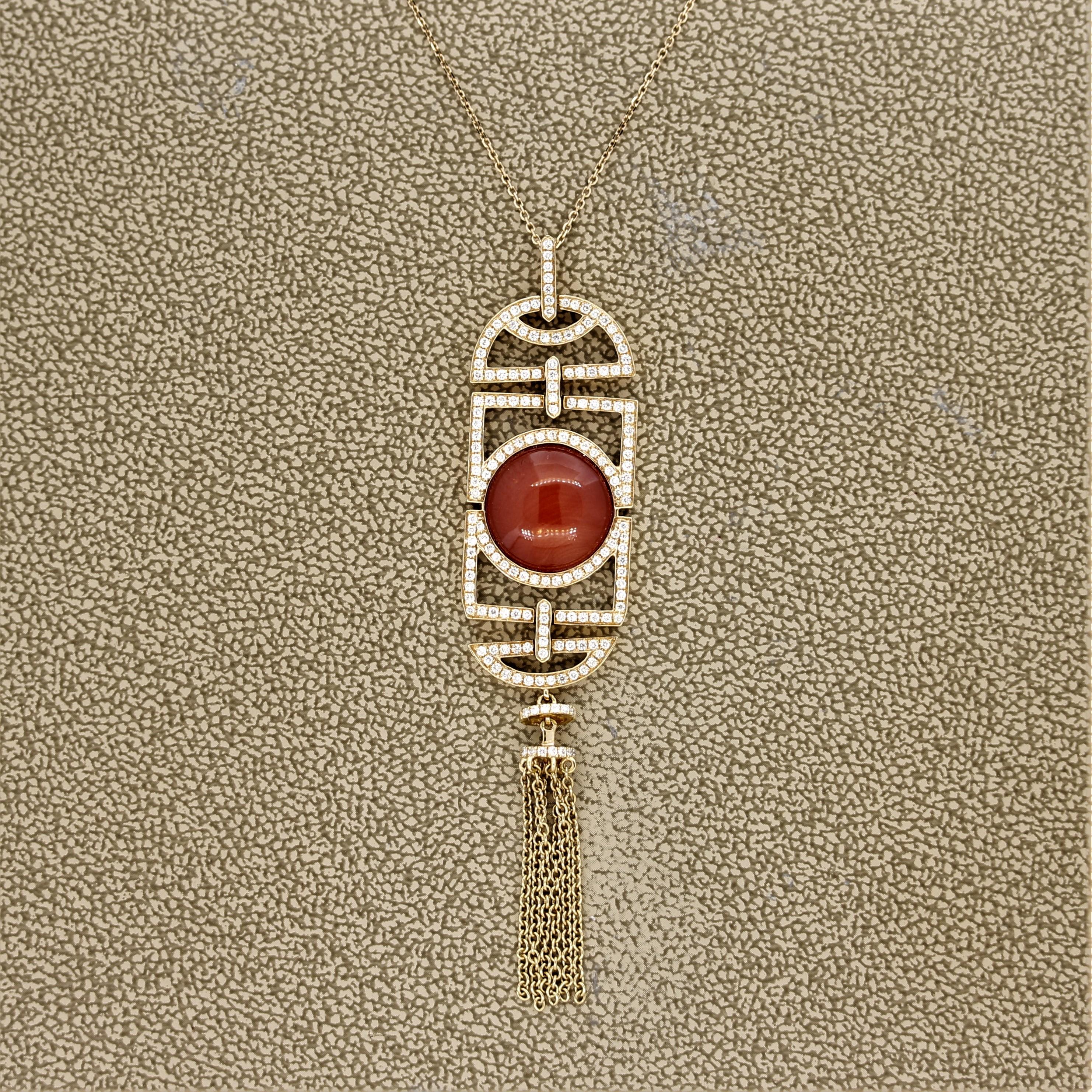 A stylish pendant featuring a 3.40 carat piece of natural red coral. It has a bright red color and a smooth polish making it appear as if the coral is glowing. It is accented by 0.54 carats of round brilliant cut diamonds set in a unique pattern.