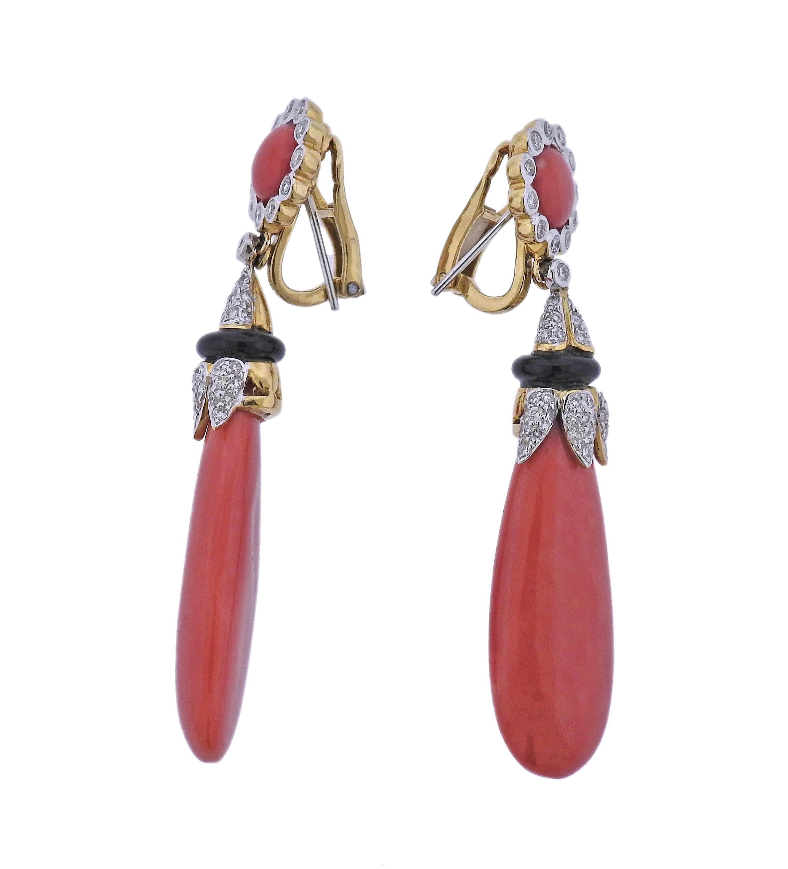 Pair of 18k yellow gold earrings featuring coral drops, onyx and approximately 0.70ctw of H/SI1 diamonds. Earrings are 61mm long. Marked 750 18k. Weight is 20.7 grams. 
