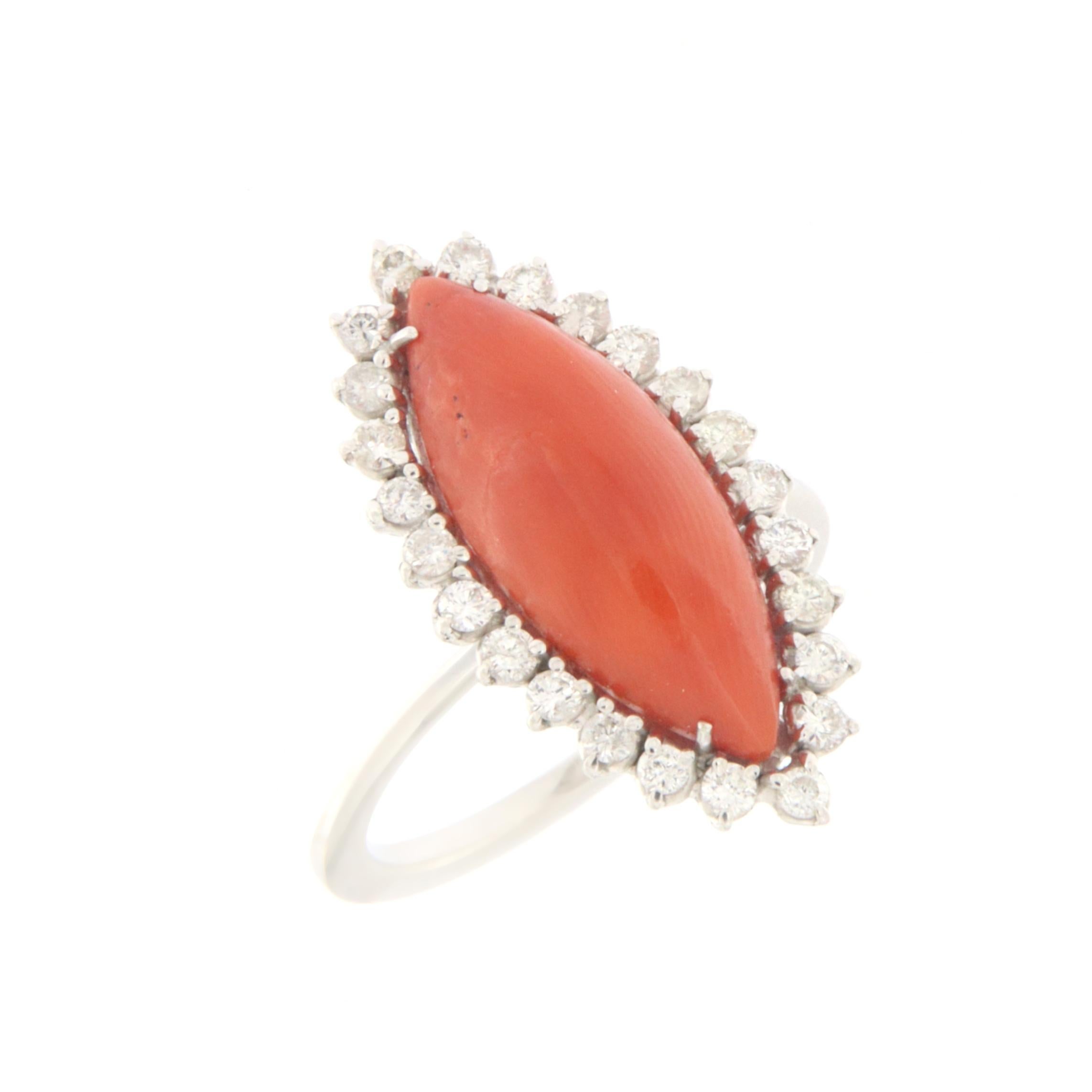 18 karat white gold cocktail ring. Handmade by our artisans assembled with diamonds and natural coral

Diamonds weight 0.54 karat
Coral weight 1.10 grams
Ring total weight 6 grams
Ring size 8.10 US 17.50 Ita
(all rings are can be resized)