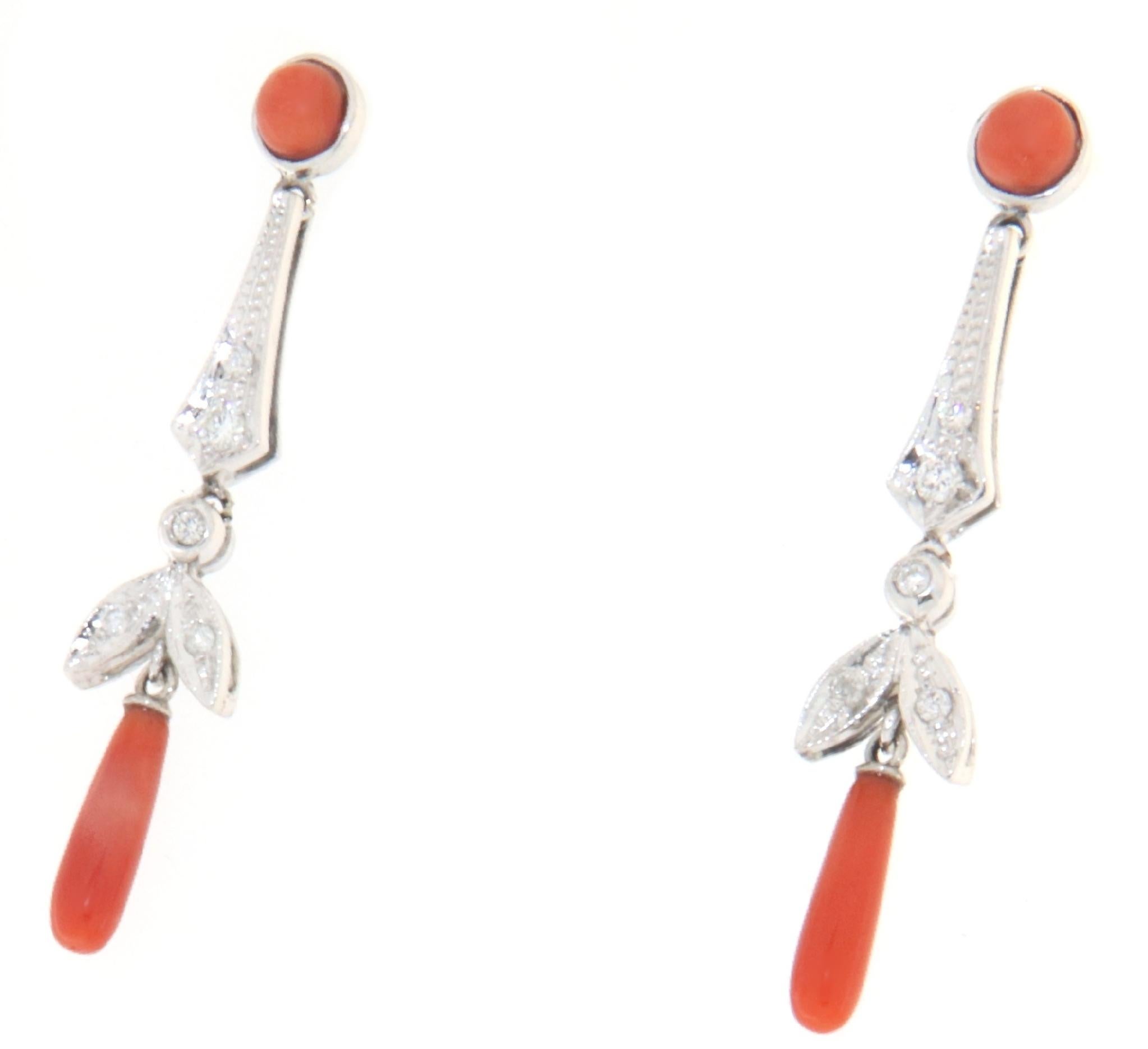 These elegant 18-karat white gold earrings are a true celebration of refinement and style, perfect for adding a touch of natural elegance to any look. The combination of vibrant red coral and sparkling diamonds creates a captivating contrast that