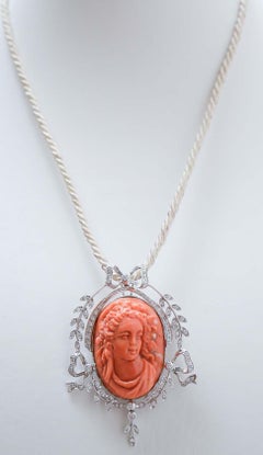 Coral, Diamonds, 18 Karat White Gold Pendant / Brooch.