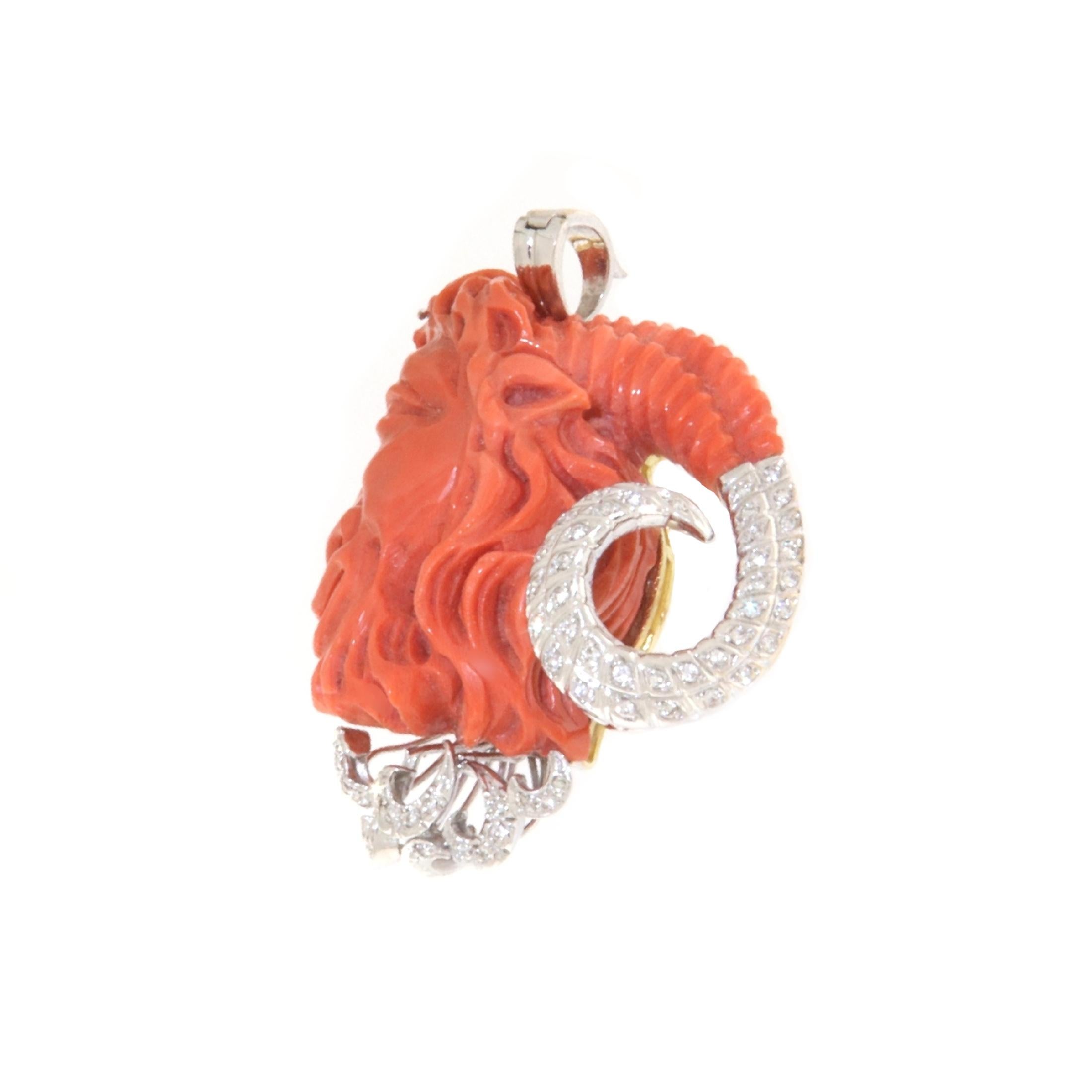 Gorgeous Pendant made of 18-karat white gold depicting a ram's head carved in coral and embellished with diamonds that complete the figure. A one-of-a-kind jewel that is impossible to replicate. A work of art created by a master craftsman from Torre