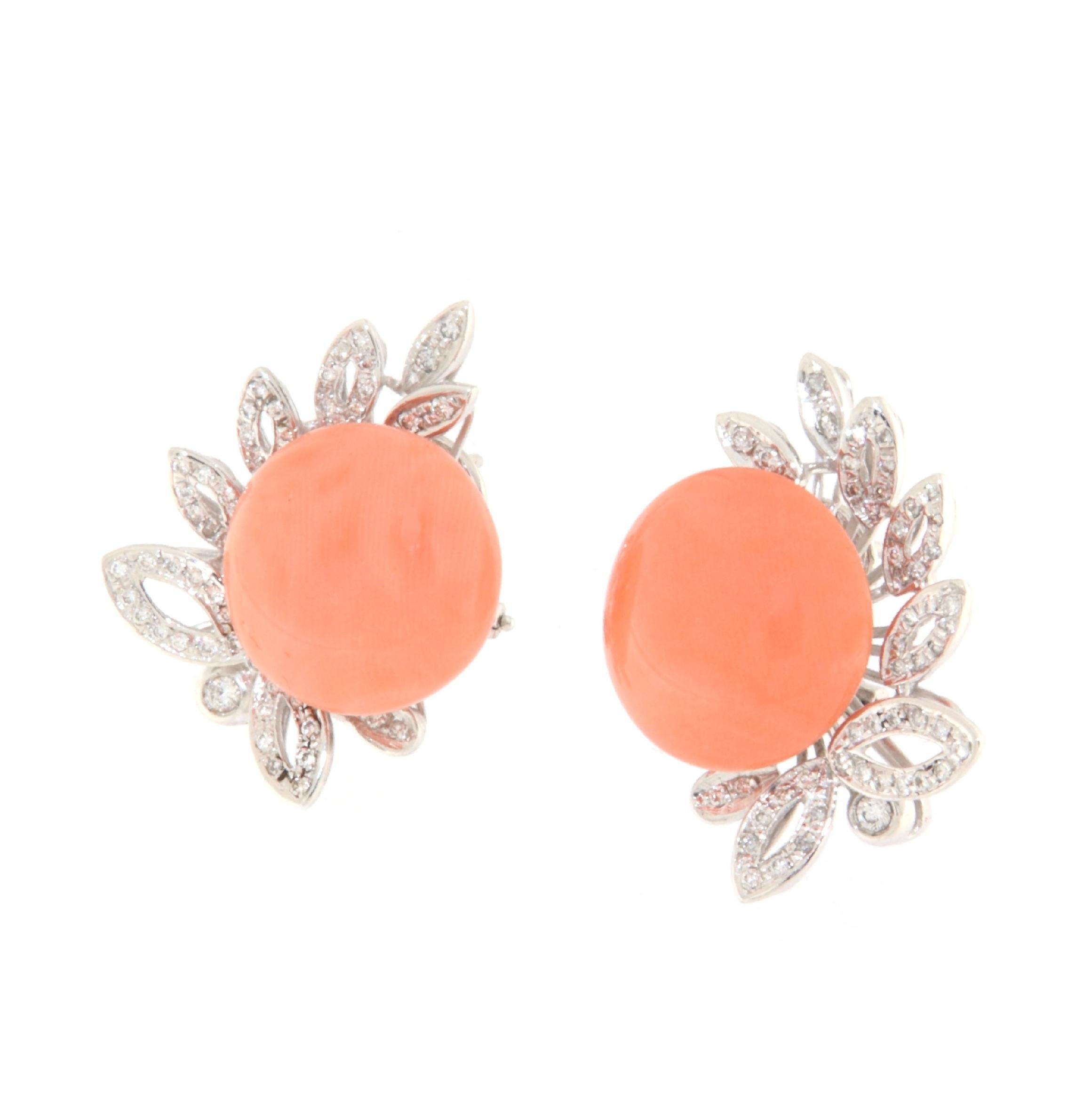 These exquisite earrings in 18-karat white gold represent sophisticated elegance, accentuated by the warm hue of pink coral and the enchanting brilliance of diamonds. Perfect for any occasion, from formal events to everyday wear, these earrings