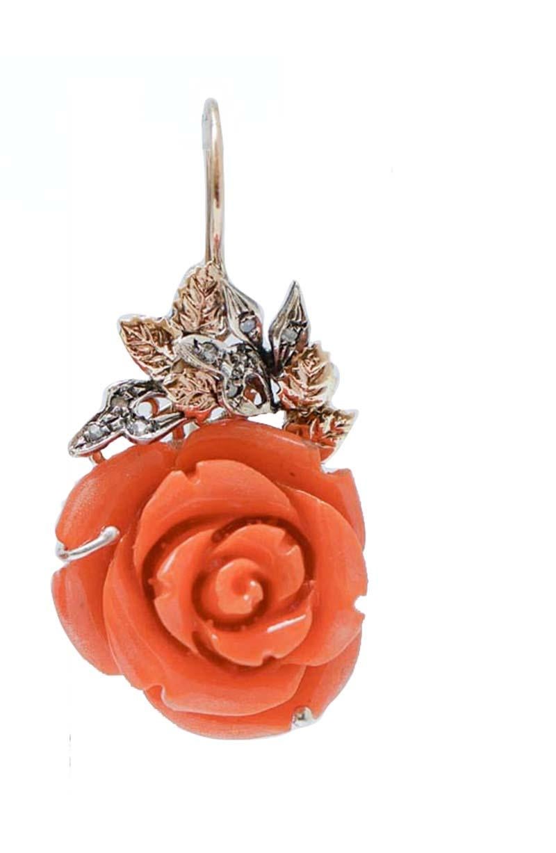 Dangle earrings in 9 kt rose gold and silver structure mounted with leaves studded with diamonds and, as pendant, a flower of coral paste.
Diamonds 0.23 ct
Coral Paste 7.30 gr
Total Weight 16.00 gr
RF  *GGIH

For any information, feel free to