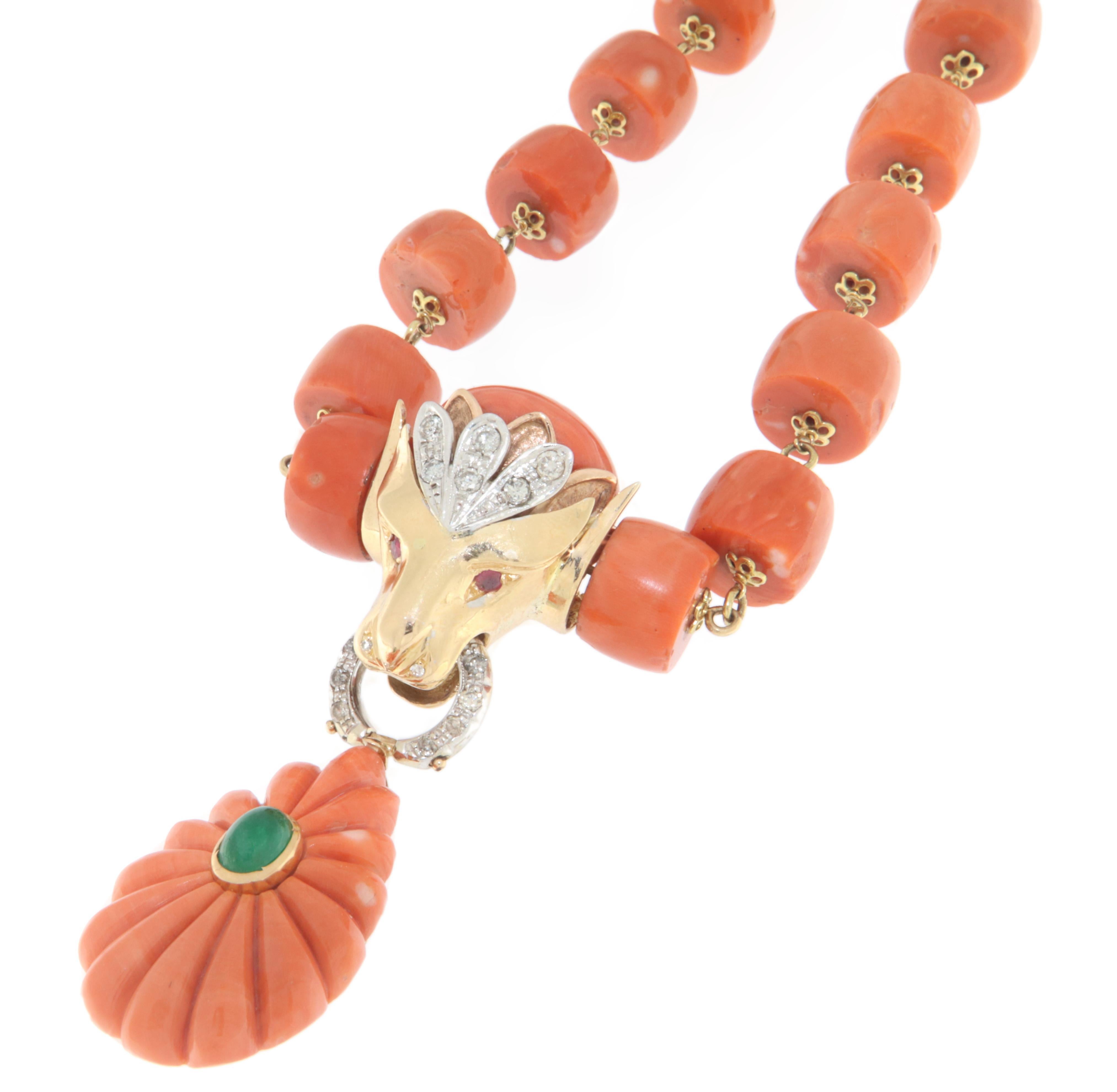 This exquisite necklace is crafted in 18-karat yellow and white gold, enriched with precious details that enhance its beauty. The design combines the elegance of natural coral with the luxury of diamonds and rubies, creating a unique and impactful
